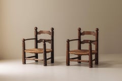 Paire de fauteuils sculpturaux de Charles Dudouyt en chêne, France années 1940.