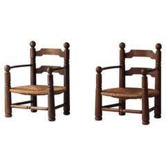 Paire de fauteuils sculpturaux de Charles Dudouyt en chêne, France années 1940.