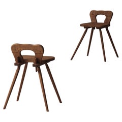 Sculptural pair of French solid oak side chairs from the 1950s