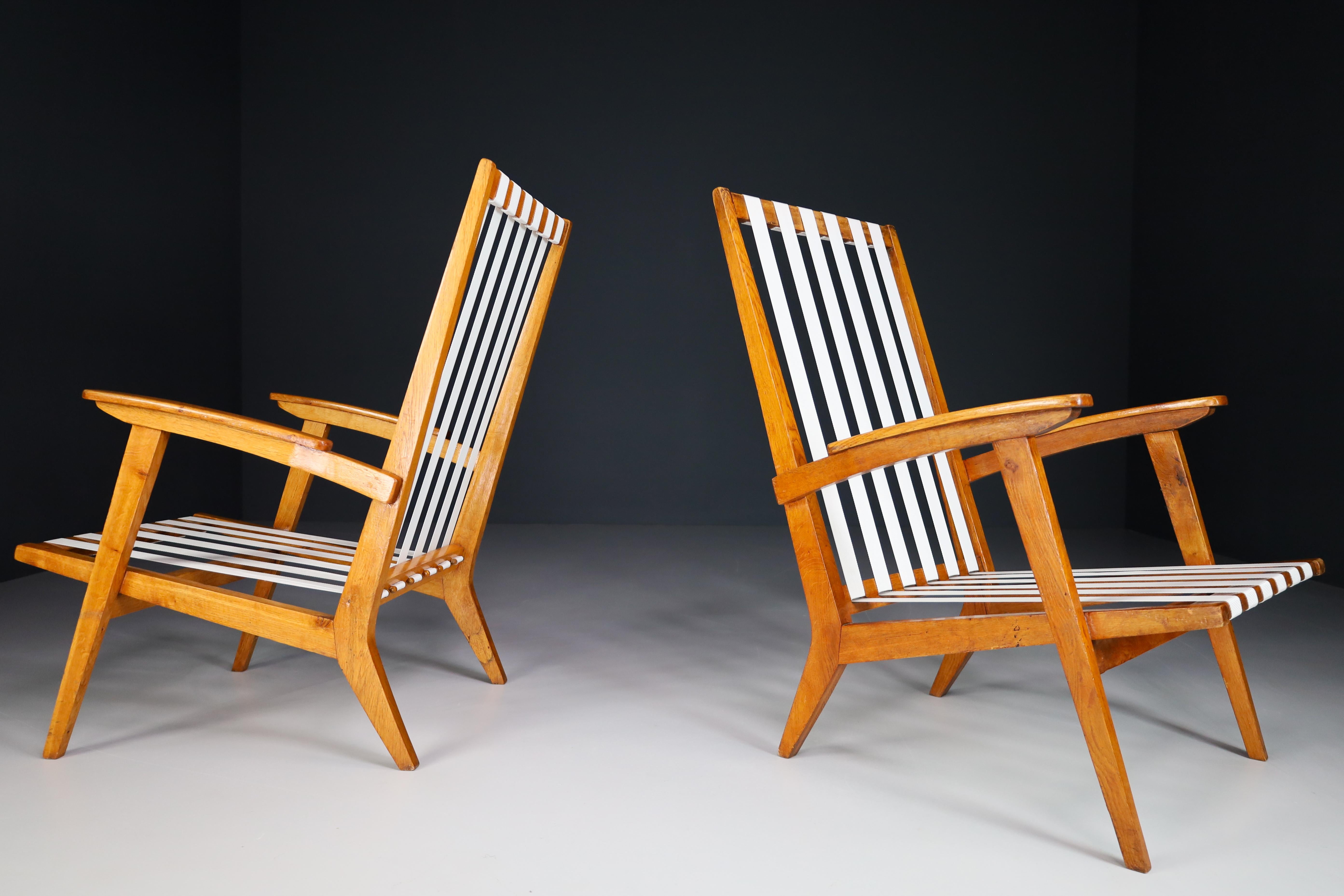 Mid-Century Modern Sculptural Lounge Chairs in Oak, France 1950s For Sale
