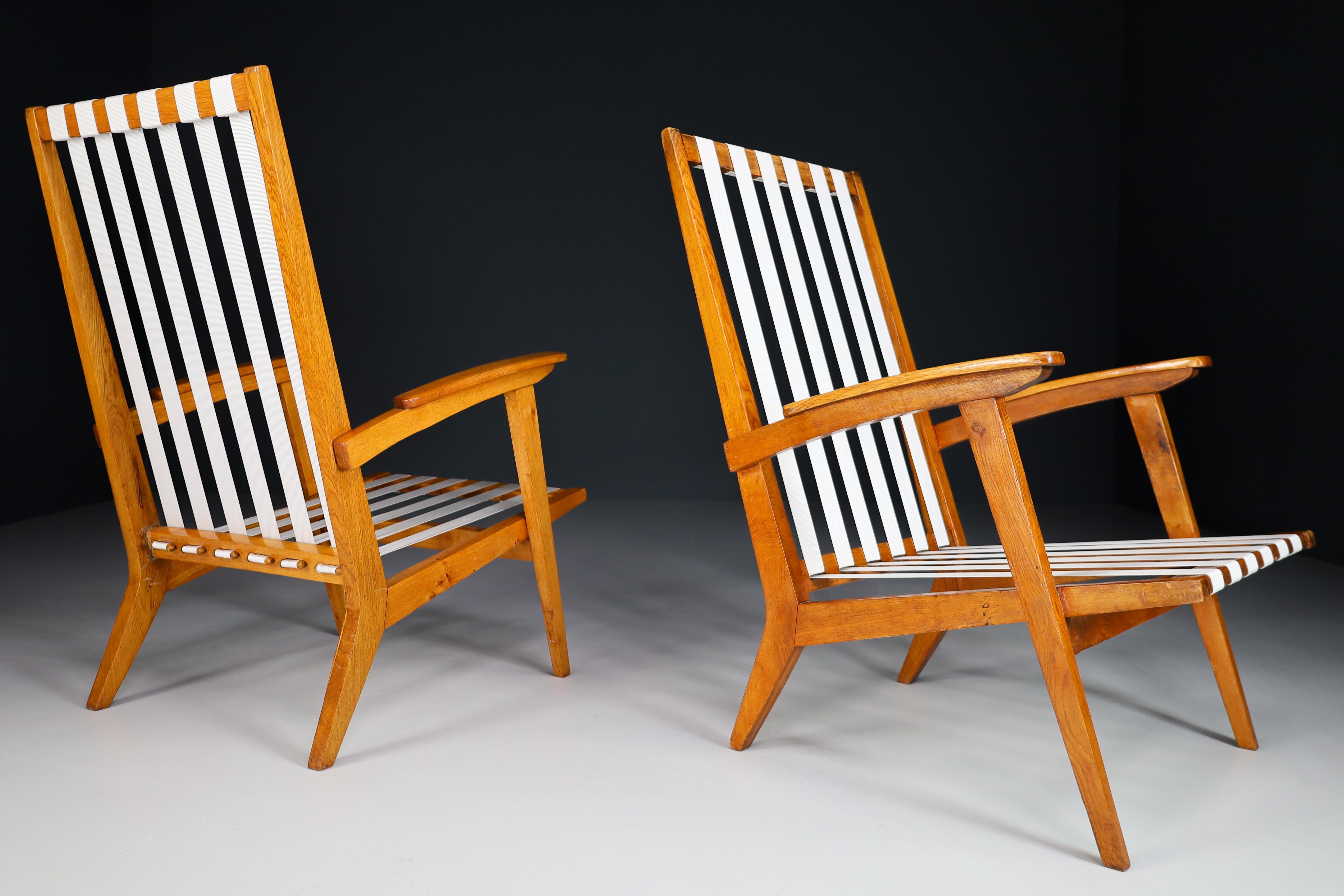 French Sculptural Lounge Chairs in Oak, France 1950s For Sale