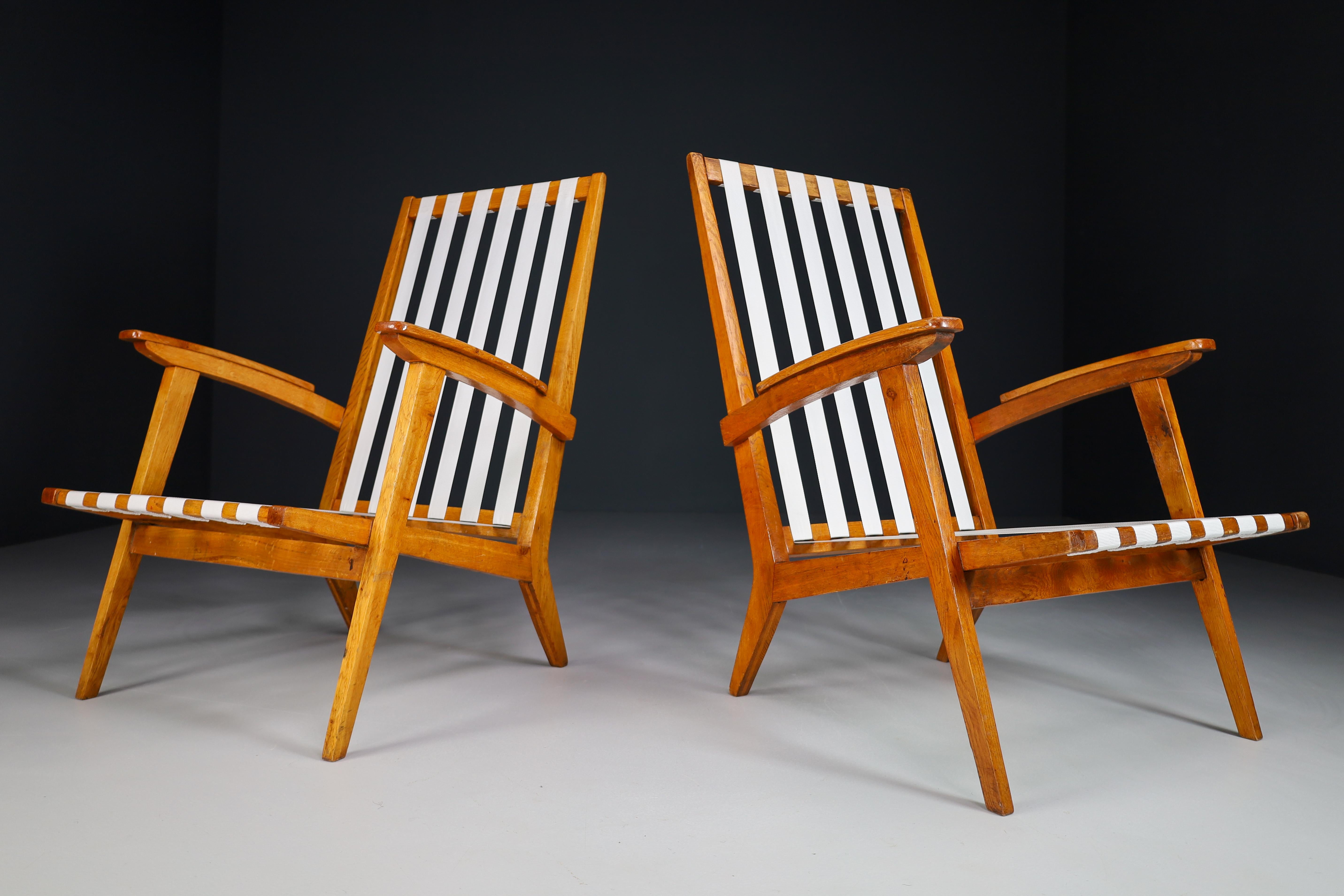 20th Century Sculptural Lounge Chairs in Oak, France 1950s For Sale