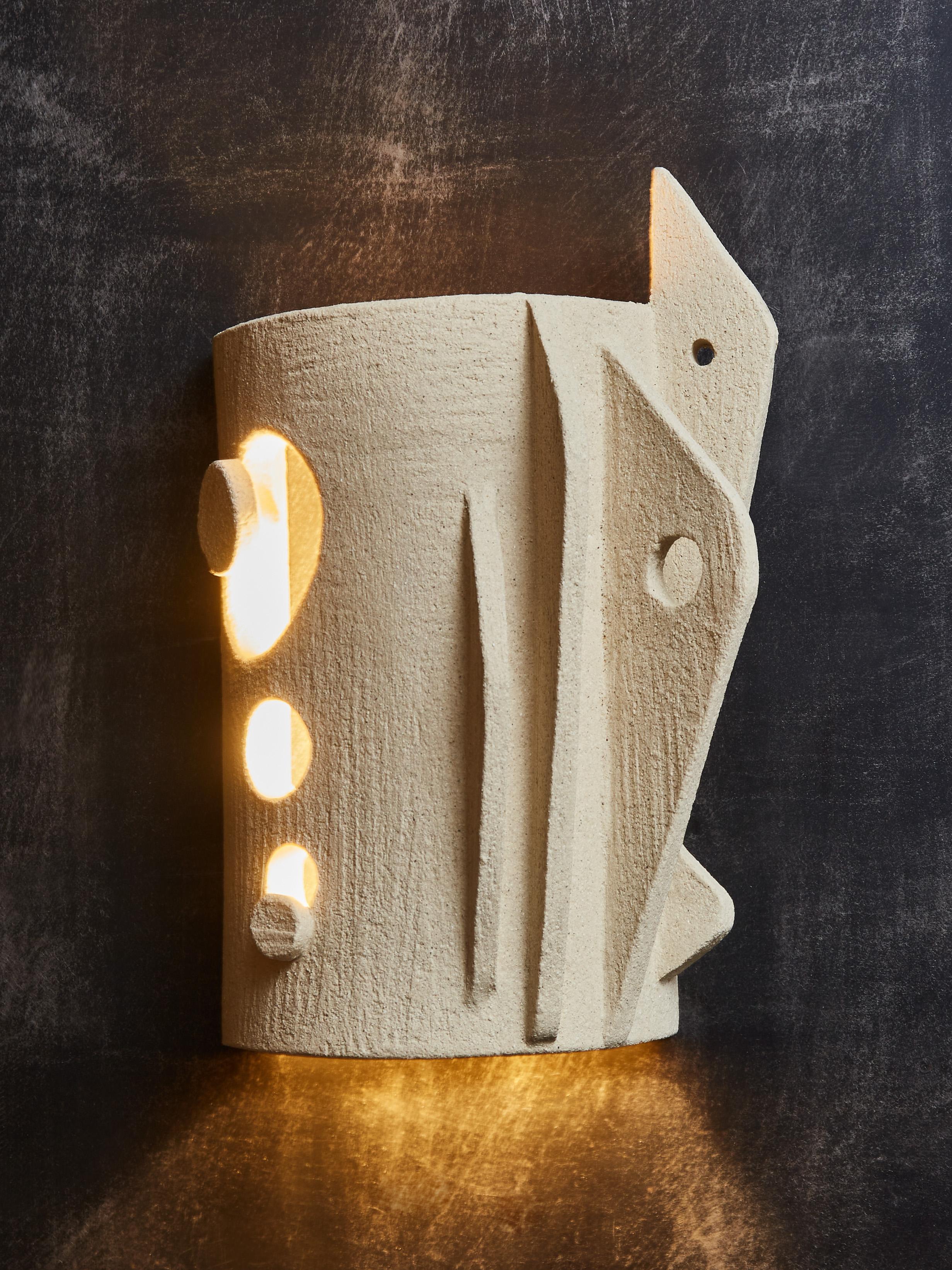 Sculptural pair of wall sconses by Olivia Cognet

Since moving to Los Angeles in 2016, French artist and desi- gner Olivia Cognet has focused on ceramics as the fertile medium through which she expresses her boundless creativity. 
With the