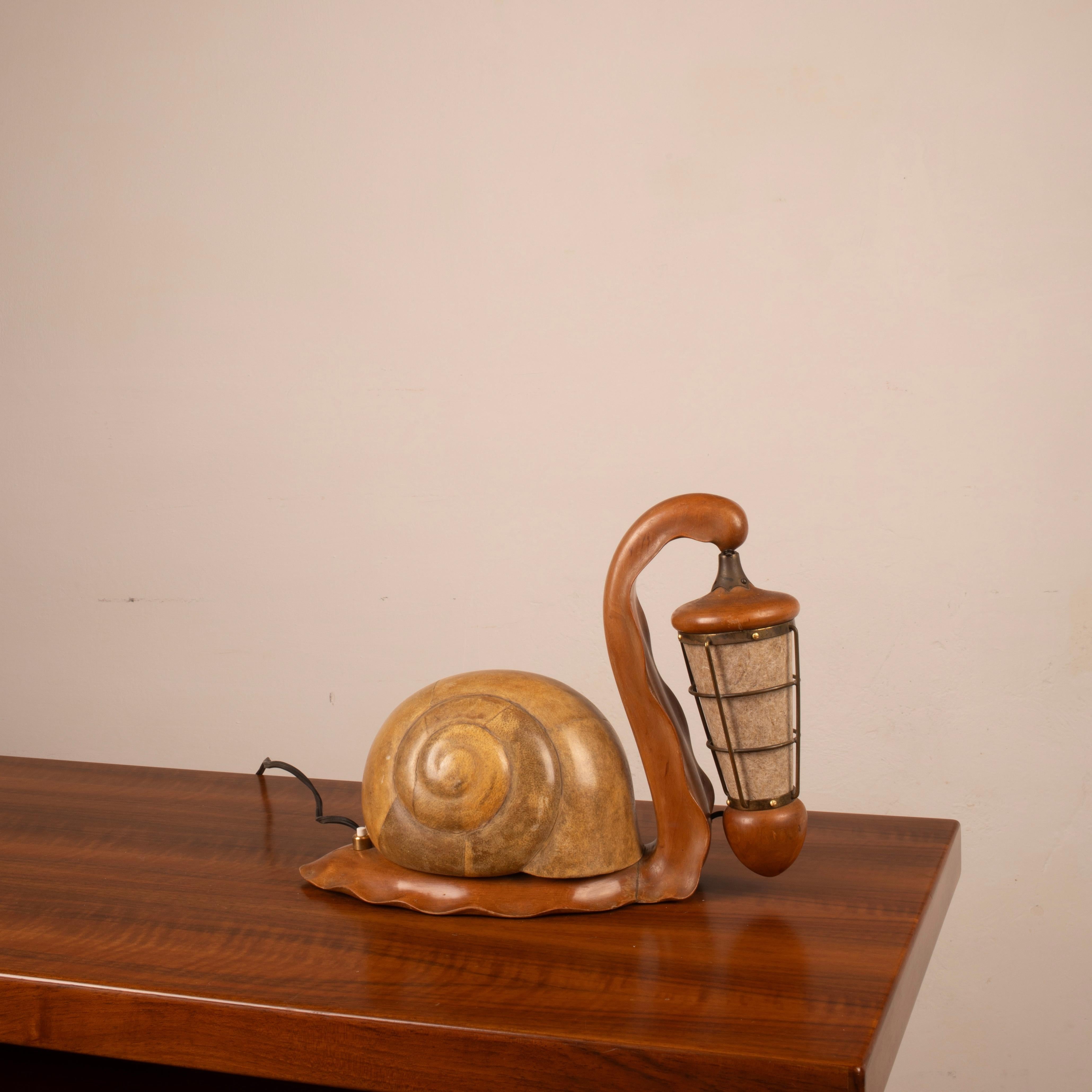 An exceptional and extremely rare lighting object designed by Aldo Tura in the 1950s, this table lamp, sculpted in the shape of a snail, fully embodies the experimental and visionary spirit of the Milanese designer, known for his creations that blur