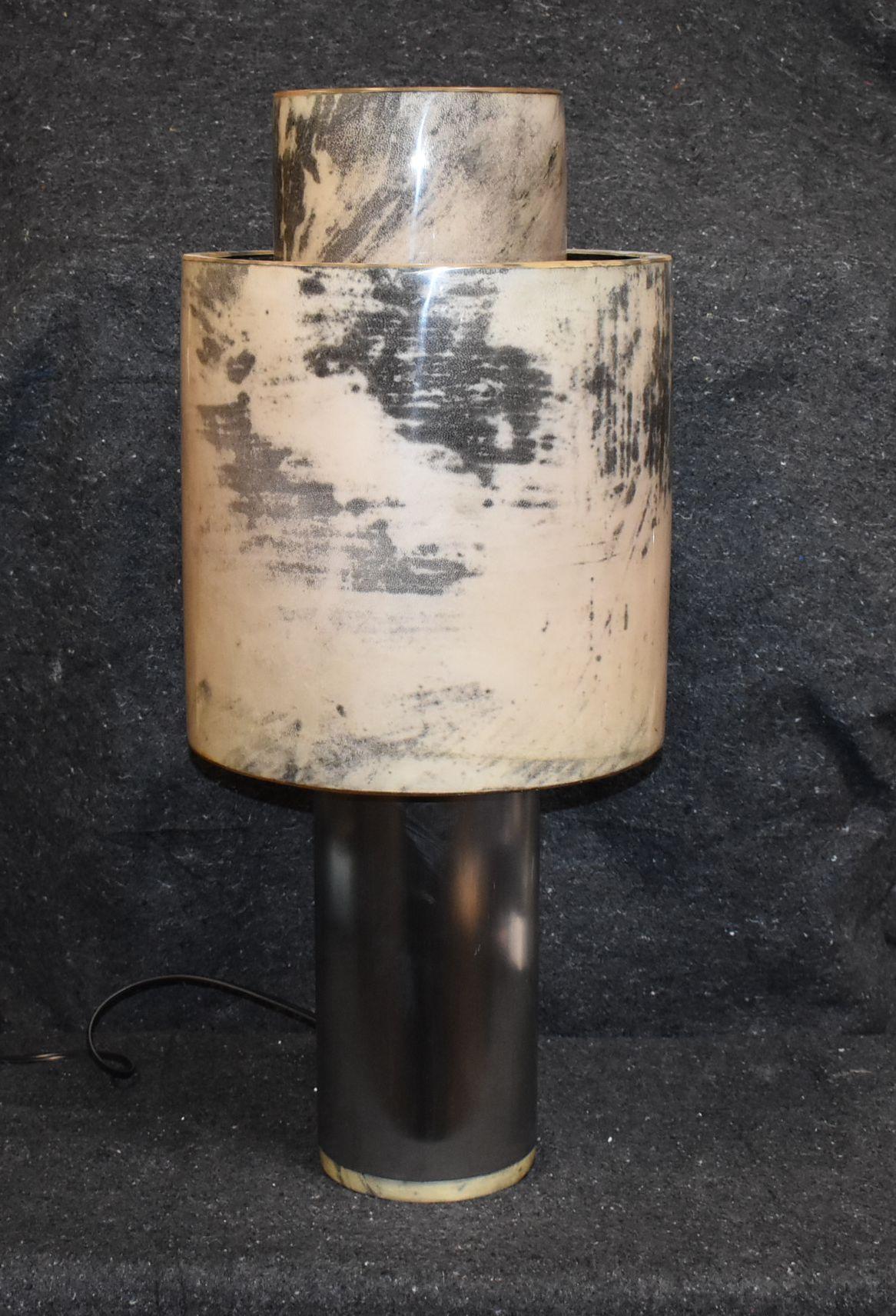 Tall steel (Matte Finish) table lamp with goatskin base and shade. (Single Socket)
Parchment is in varying shades of very light and dark gray. (High gloss polyester resin filled finish). 

Additional dimensions of lamp shade:
Diameter 14