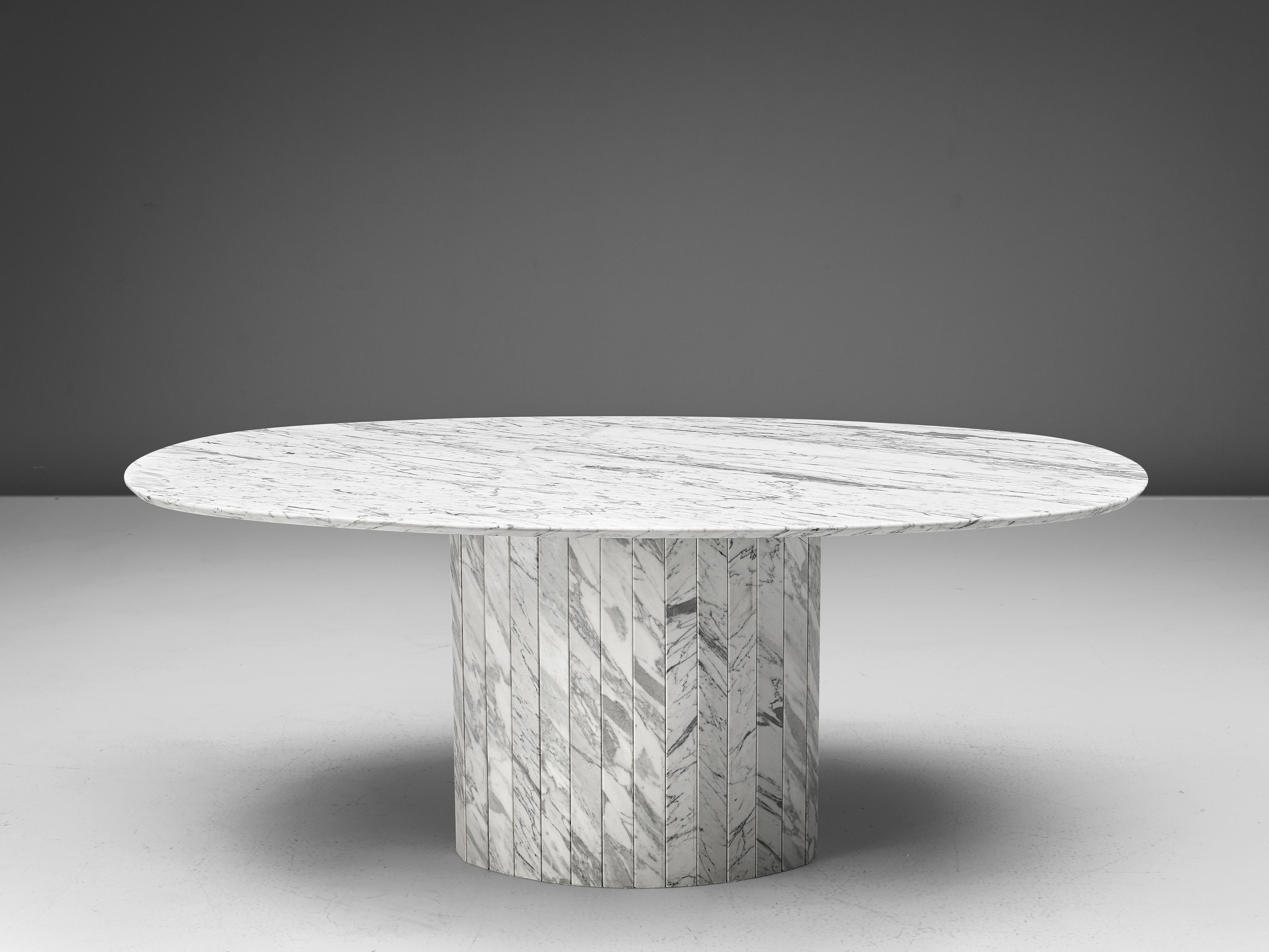 Oval dining table, white marble, Germany, 1970s

This archetypical pedestal table is a skillful example of Postmodern design. The table is executed in white marble with grey veins. The oval table features no joints or clamps and is architectural