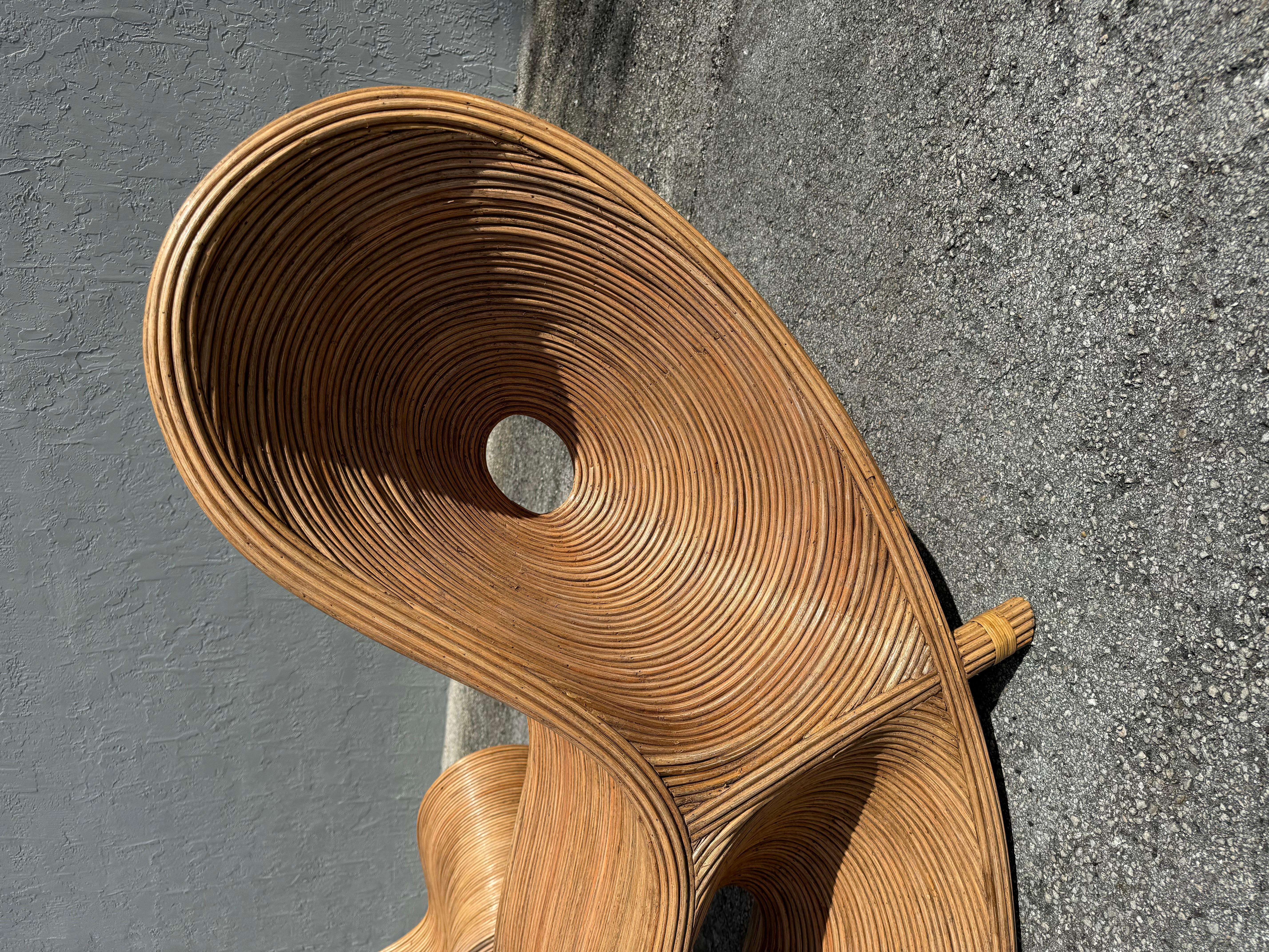 Exceptional pair of hand crafted pencil reed lounge chairs. These sculptural organic modern chairs have both form and function with flowing lines adding serenity to any space. 