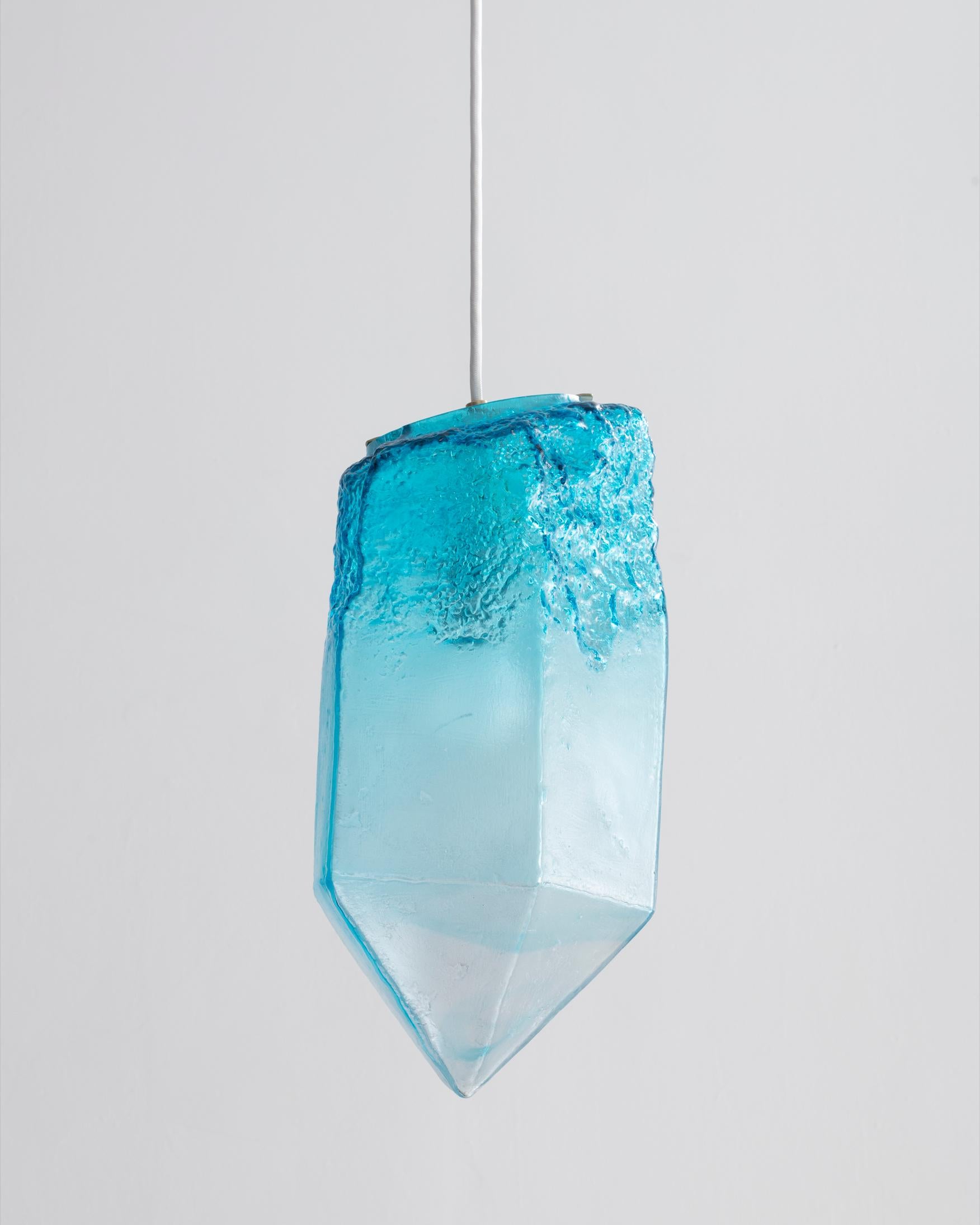 Crystal illuminated sculptural pendant in hand blown turquoise glass. Designed and made by Jeff Zimmerman, USA, 2016.
 