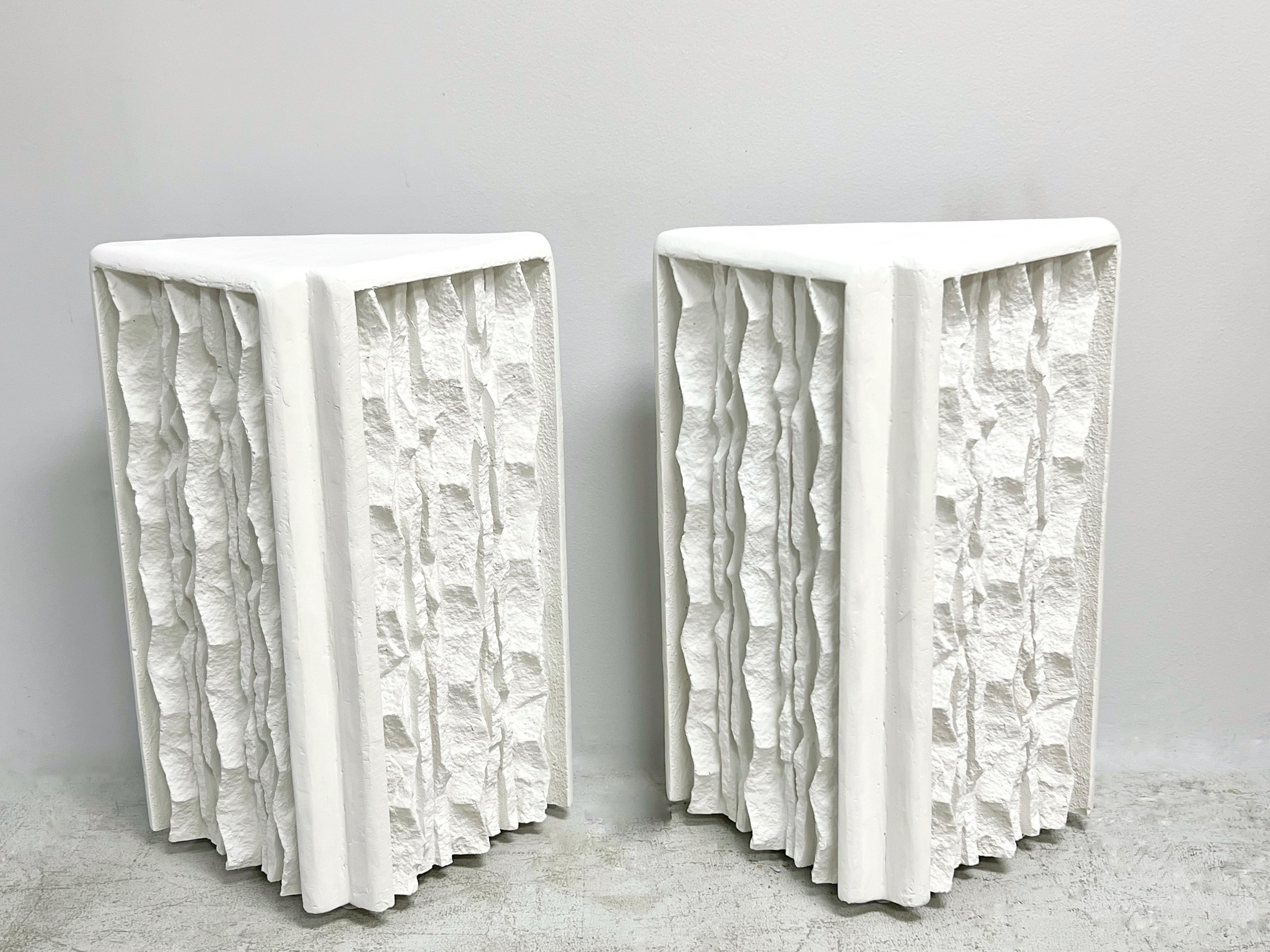 A pair of sculptural plaster bases for a console table. 