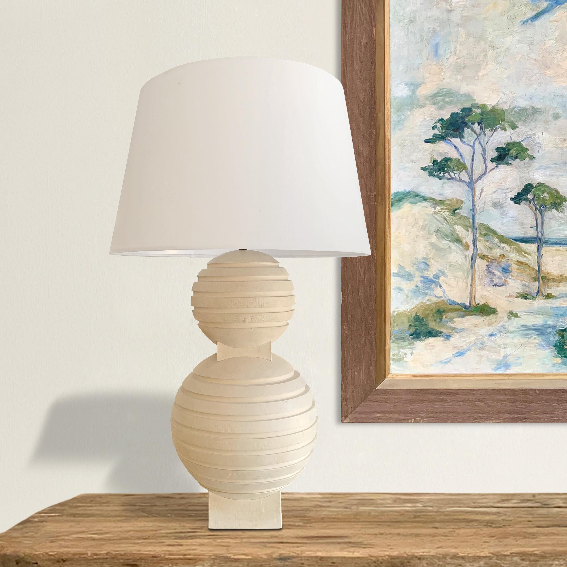 A fantastic large-scale plaster table lamp with a wonderfully sculptural form with two spheres with incised lines and a hand-applied textural finish. Wired for the US with a linen shade.