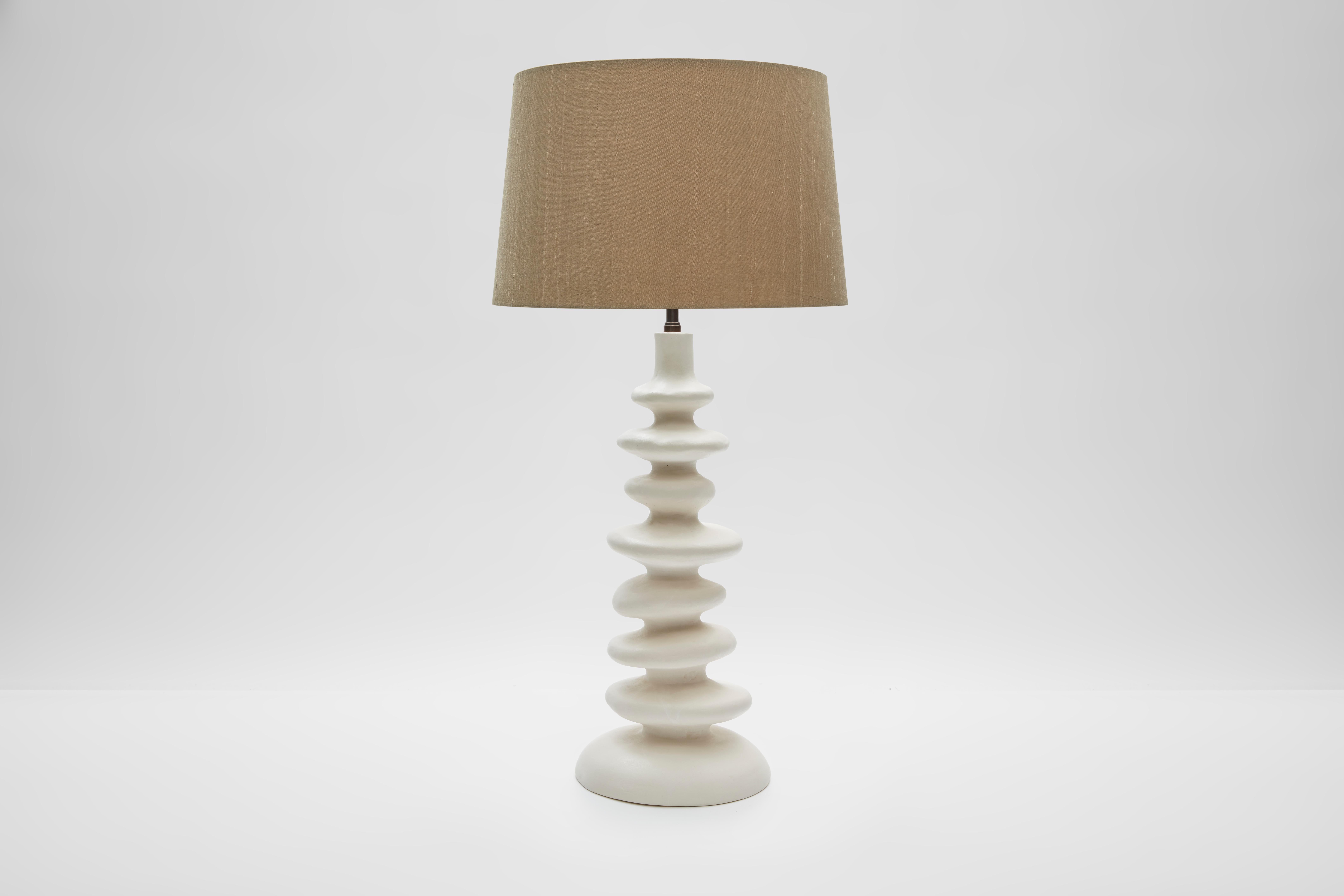 KIRA Plaster lamp by Victoria Ellis (commissioned by Simon Orrell Design)
Height 46cm Width 20cm (at base) Depth 20cm
Finish: Plaster / Lamp fittings: Bronze or Brass
Plug and inline switch: Black or White / Flex: Black, White, Gold, Bronze or