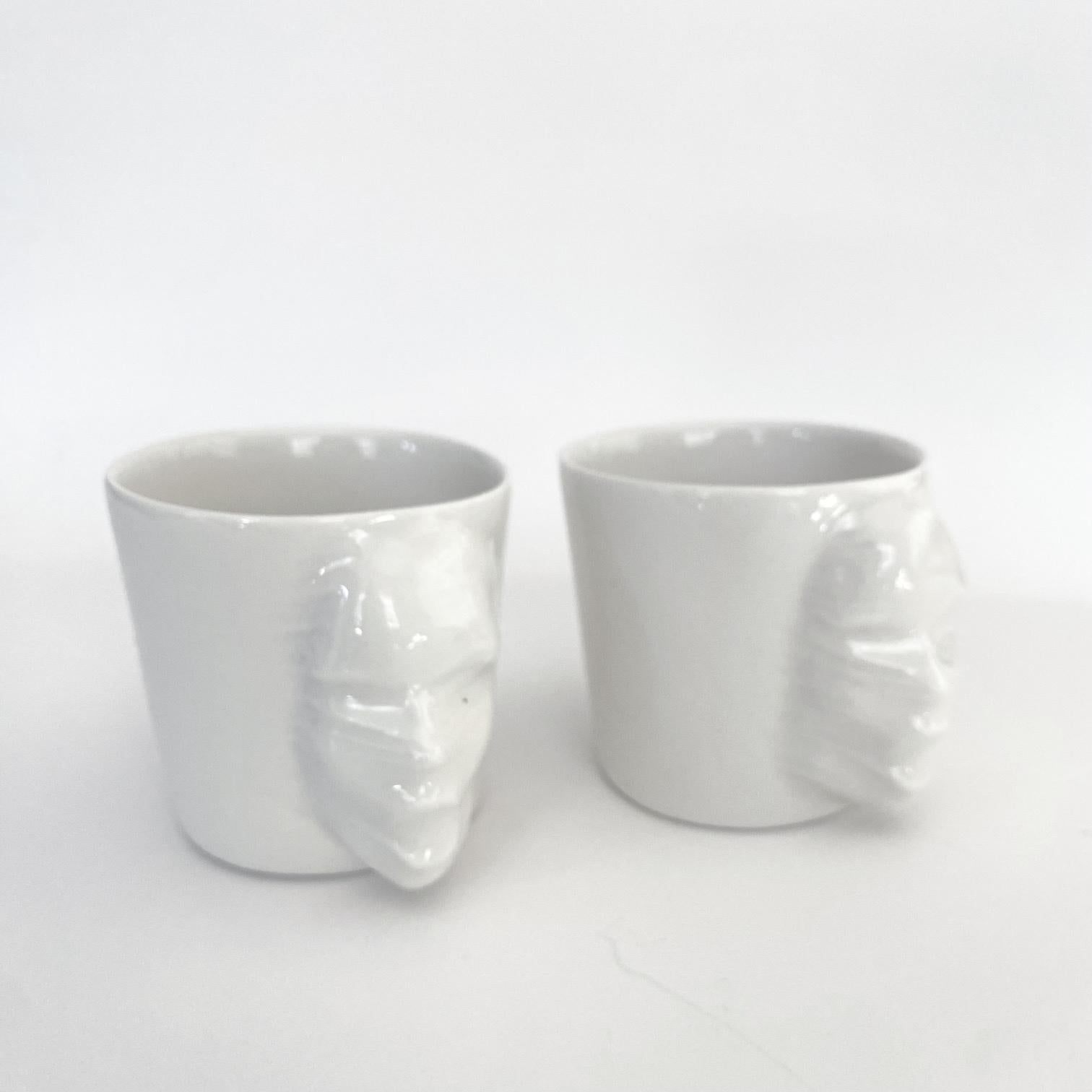 A set of 2 sculptural porcelain cups handmade by the ceramic artist Hulya Sozer. 
Food safe glaze.
Dishwasher safe.

Height: 6cm / Depth: 8cm / Diameter: 6cm
Volume: 100ml
Set includes 2 porcelain cups of 100ml

Hulya Sozer is a ceramic artist,