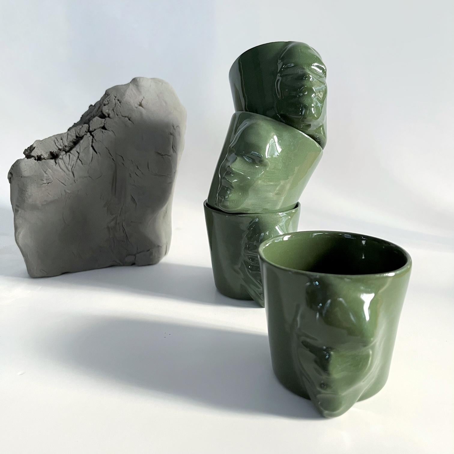 A set of 4 sculptural porcelain cups handmade by the ceramic artist Hulya Sozer. 
Food safe glaze.
Dishwasher safe.

Height: 6cm / Depth: 8cm / Diameter: 6cm
Volume: 100ml
Set includes 4 porcelain cups of 100ml

* Colors may slightly vary due to
