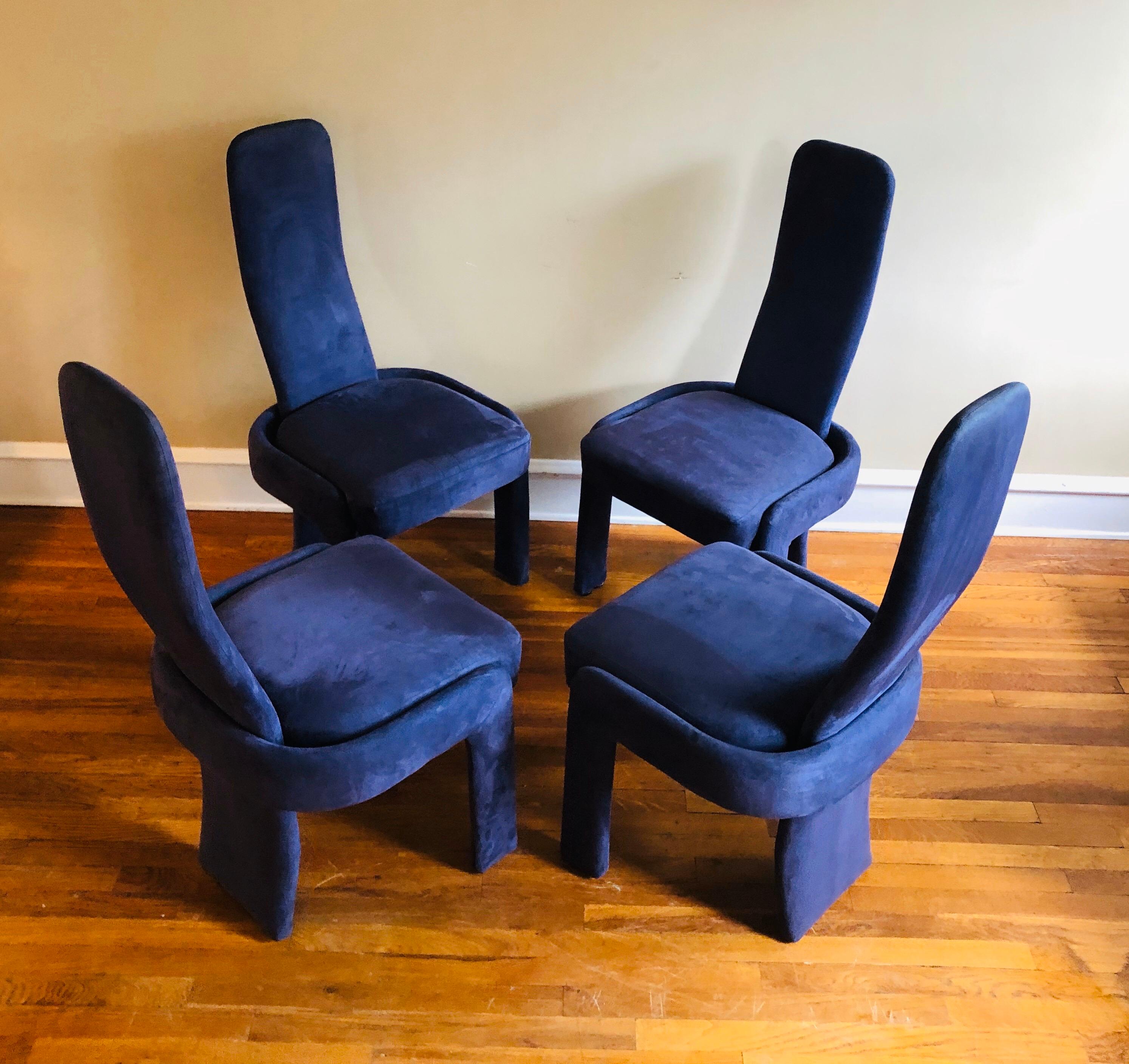 The most wonderful dining chairs from the 1990s, in a light purple ultra-suede. Sculptural arms on two chairs, and 4 side chairs. Upholstery is in excellent condition lest for two chairs where there are small spots of wear. See pictures. Quite clean
