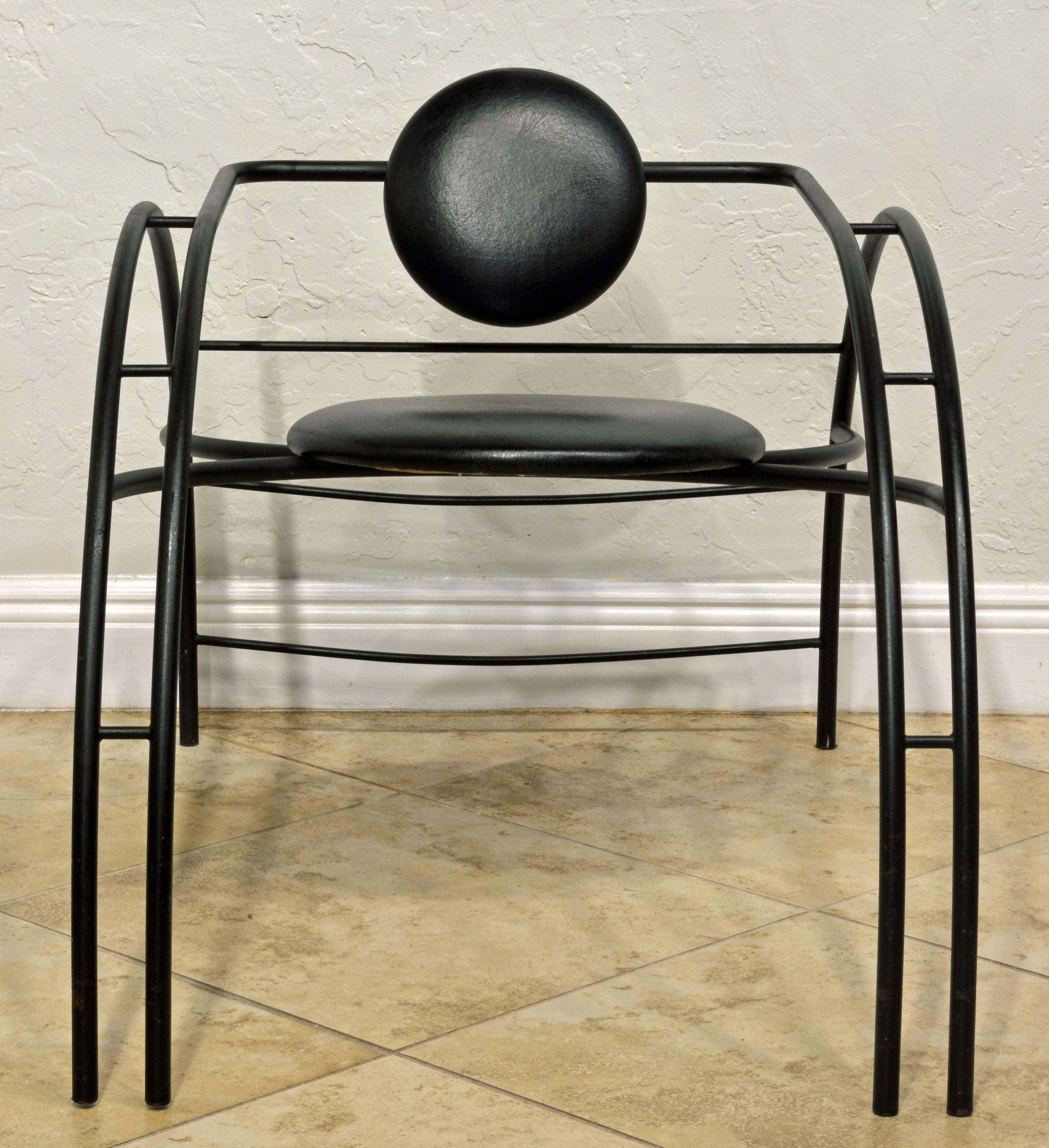 This iconic Postmodern Memphis style lounge chair by the Canadian Design Group Les Amisca is not often offered on the market. It is an abstract composition of the tubular steel framework with lines accented by the circular seat and backrest. It is