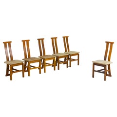 Sculptural postmodern dining chairs in wood with curved back, 1980s