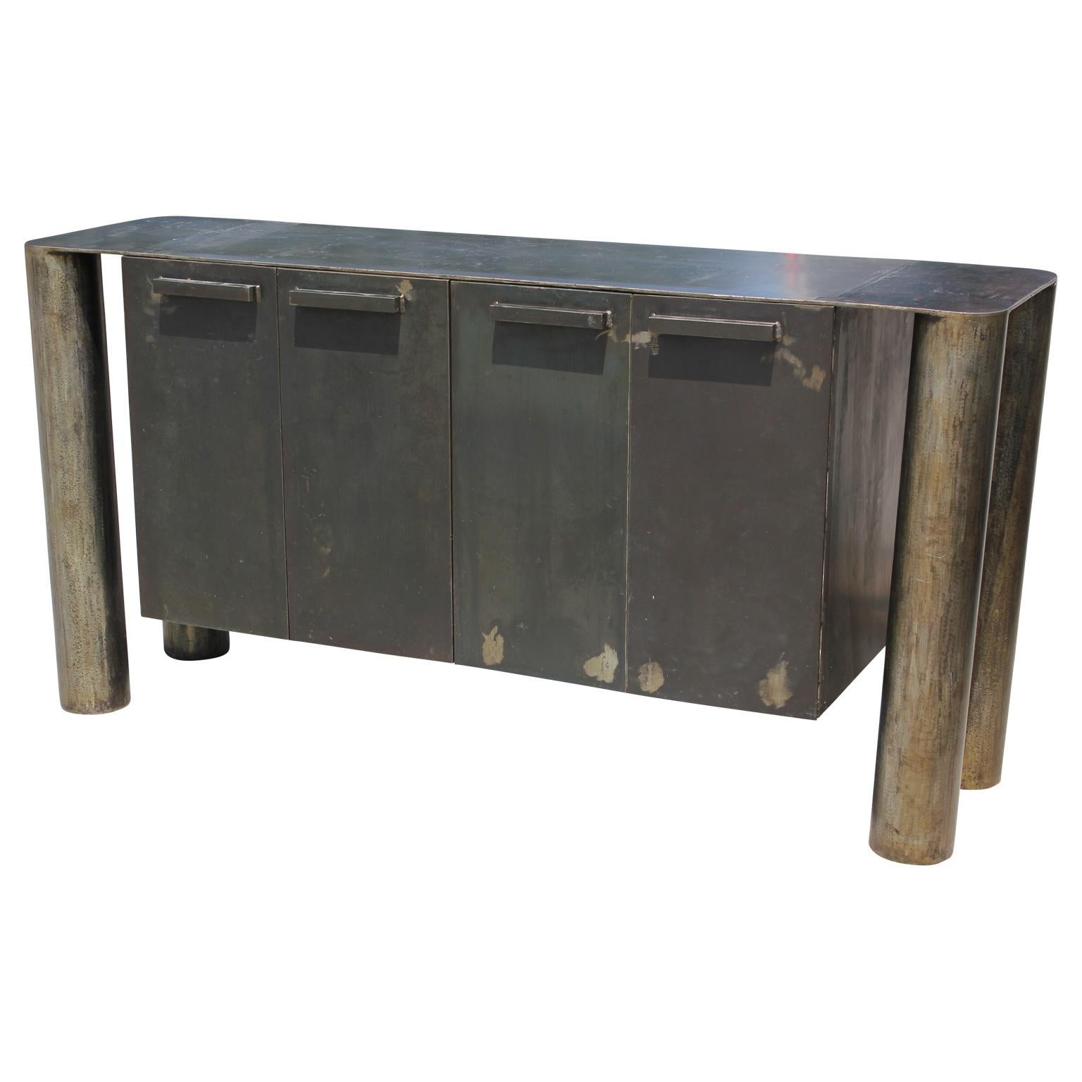 Lovely sculptural Postmodern / industrial custom-made steel credenza or sideboard. Features four open cabinet spaces. Perfect addition to any space looking for functional and artful furniture.