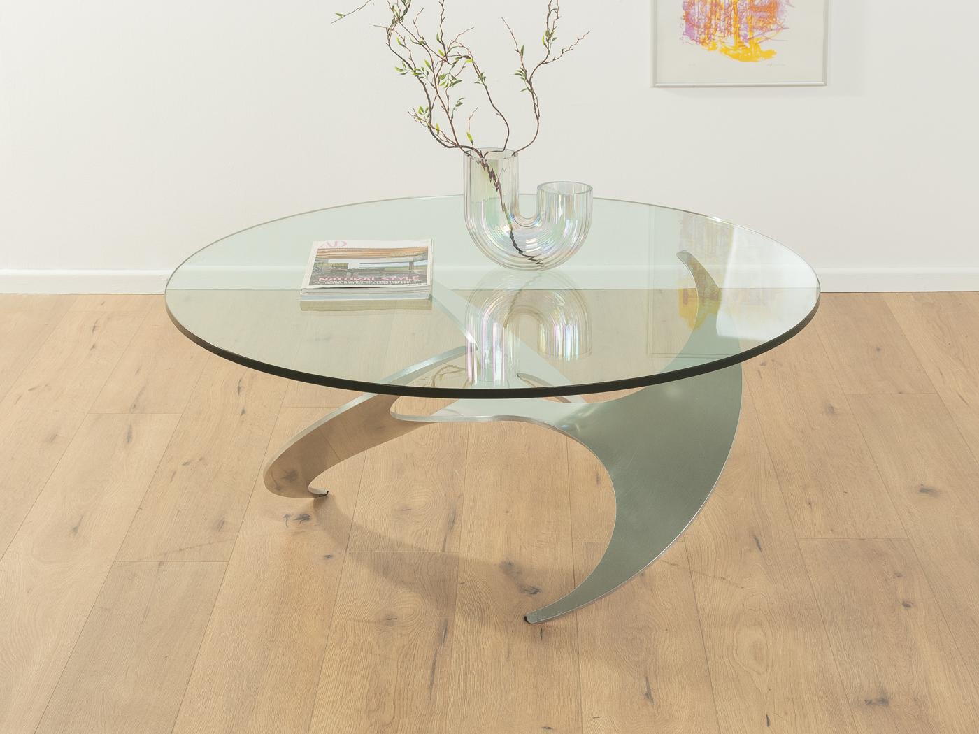 Sculptural propeller coffee table by Knut Hesterberg for Ronald Schmitt from the 1960s. 19mm thick glass top on high quality aluminum frame. 

Quality Features:
very good workmanship
high-quality materials
Made in Germany. Design: Knut Hesterberg,