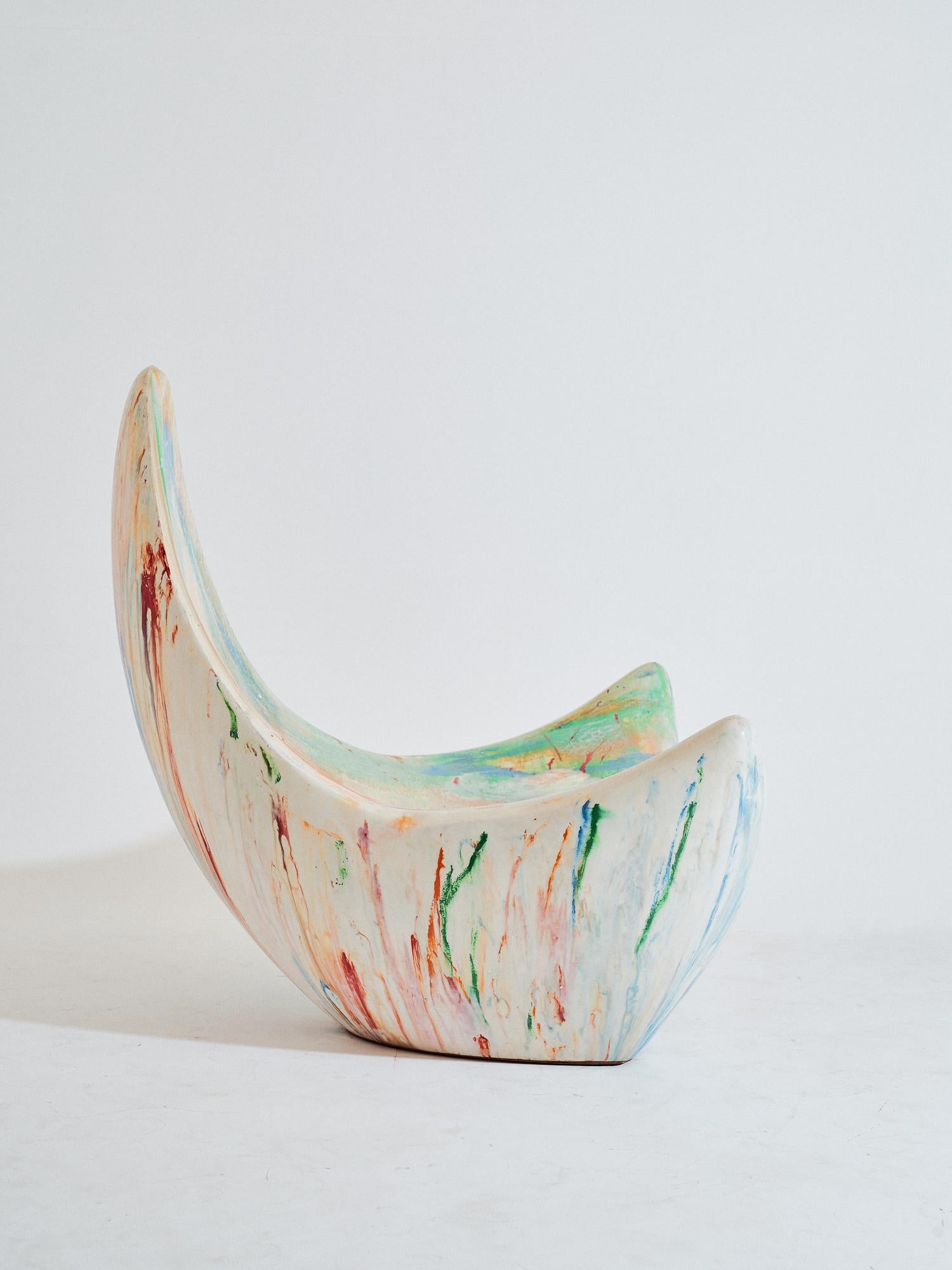 Contemporary, hand sculpted fiberglass armchair - Popcorn Armchair by Kunaal Kyhaan. The sensual form, is cast in a sculpted Rainbow finish, organically created using dyes during the fiberglass casting process. Layers of fiber are hand moulded by