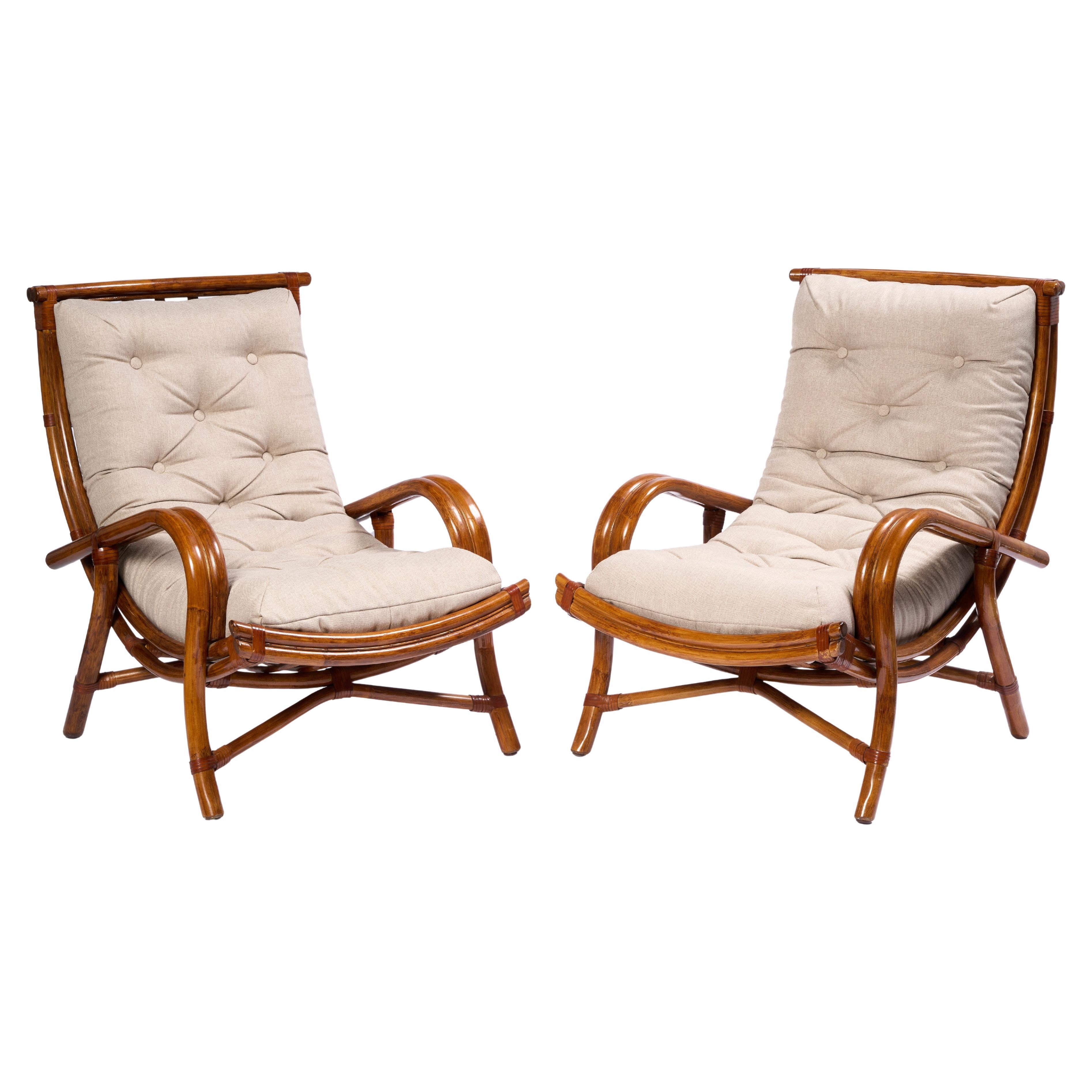 Pareja de sillas escultóricas de ratán con cojín