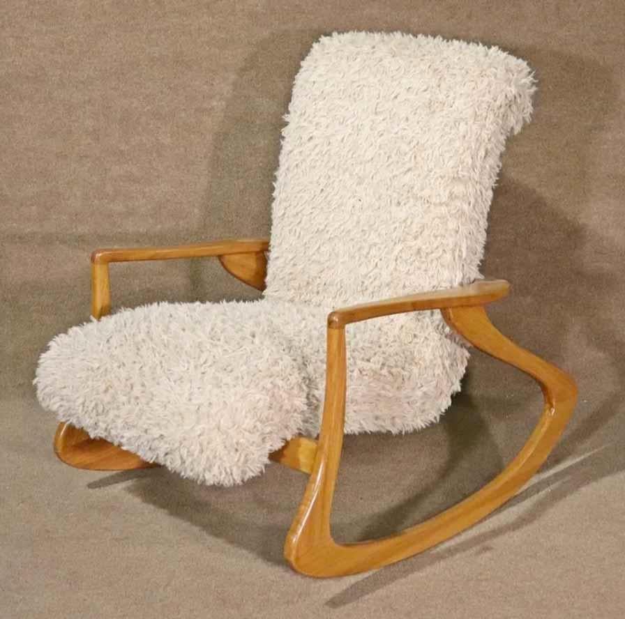 Mid-century modern style rocking chair in the design of Vladimir Kagan. Great form throughout the wrapping wood frame, holding up the floating seat.
Please confirm location.