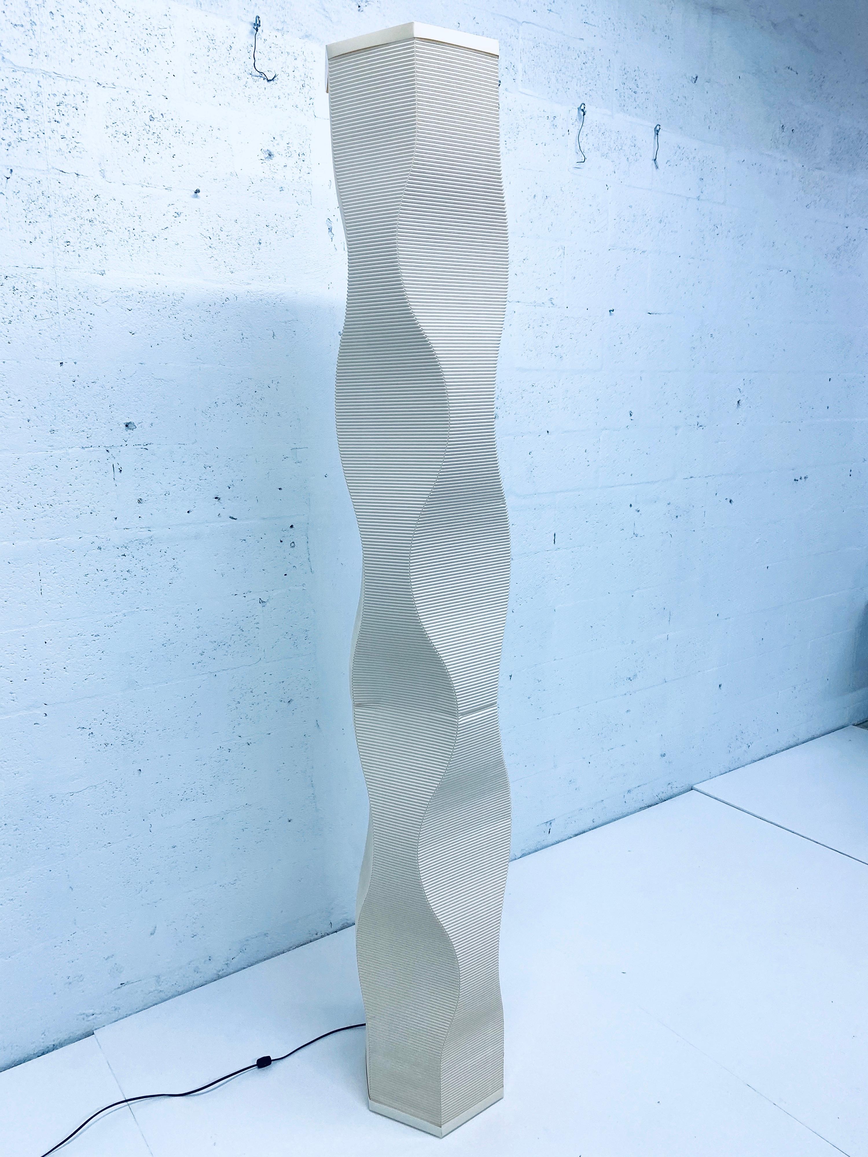 Made of corrugated parchment paper, Roland Simmons designed this floor lamp to be sculptural and functional. Signed and numbered. 