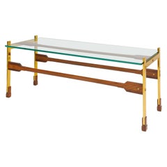 Mesa baja escultórica de palisandro y latón