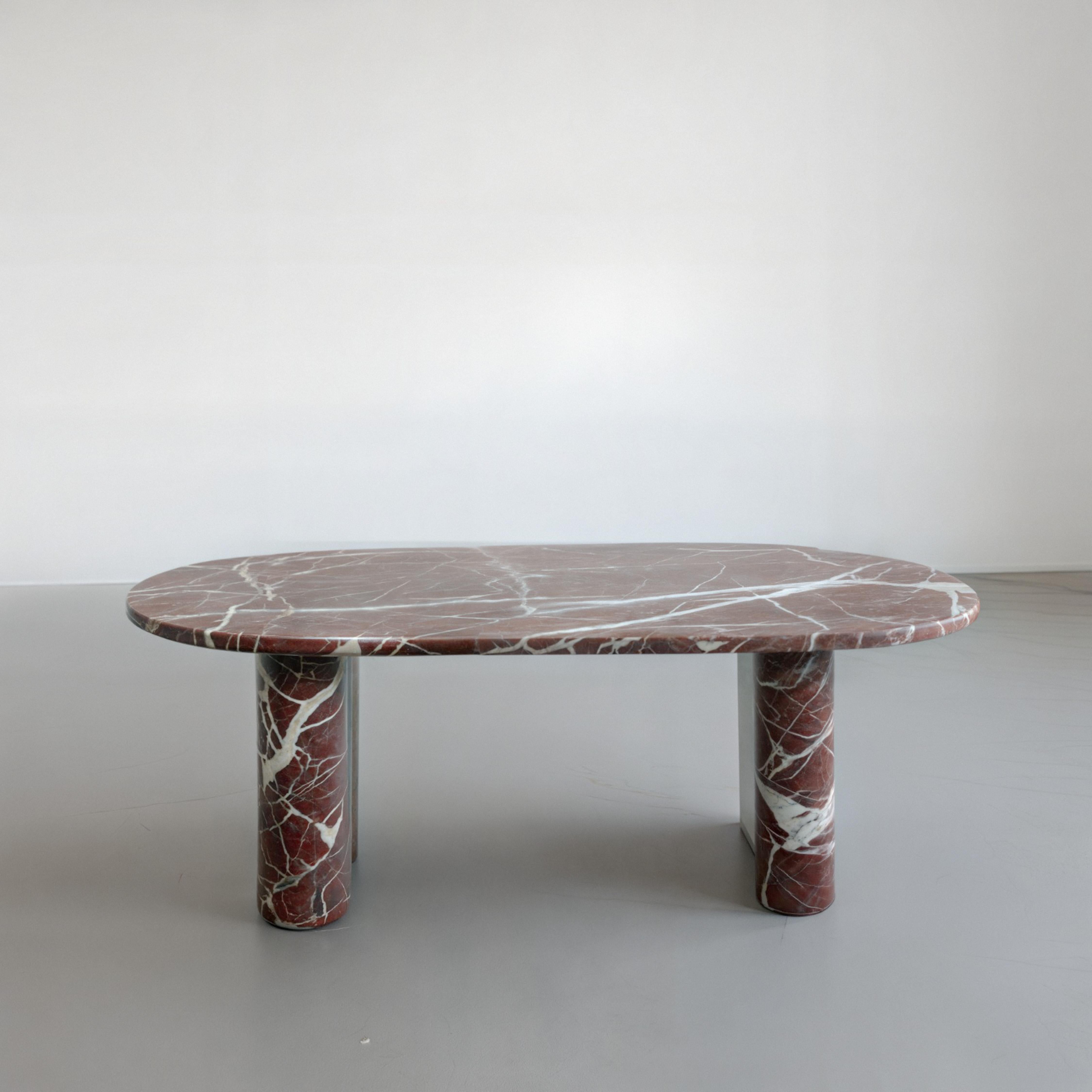 Turc Table de salle à manger sculpturale en marbre Rosso Levanto - Table en marbre au design italien en vente