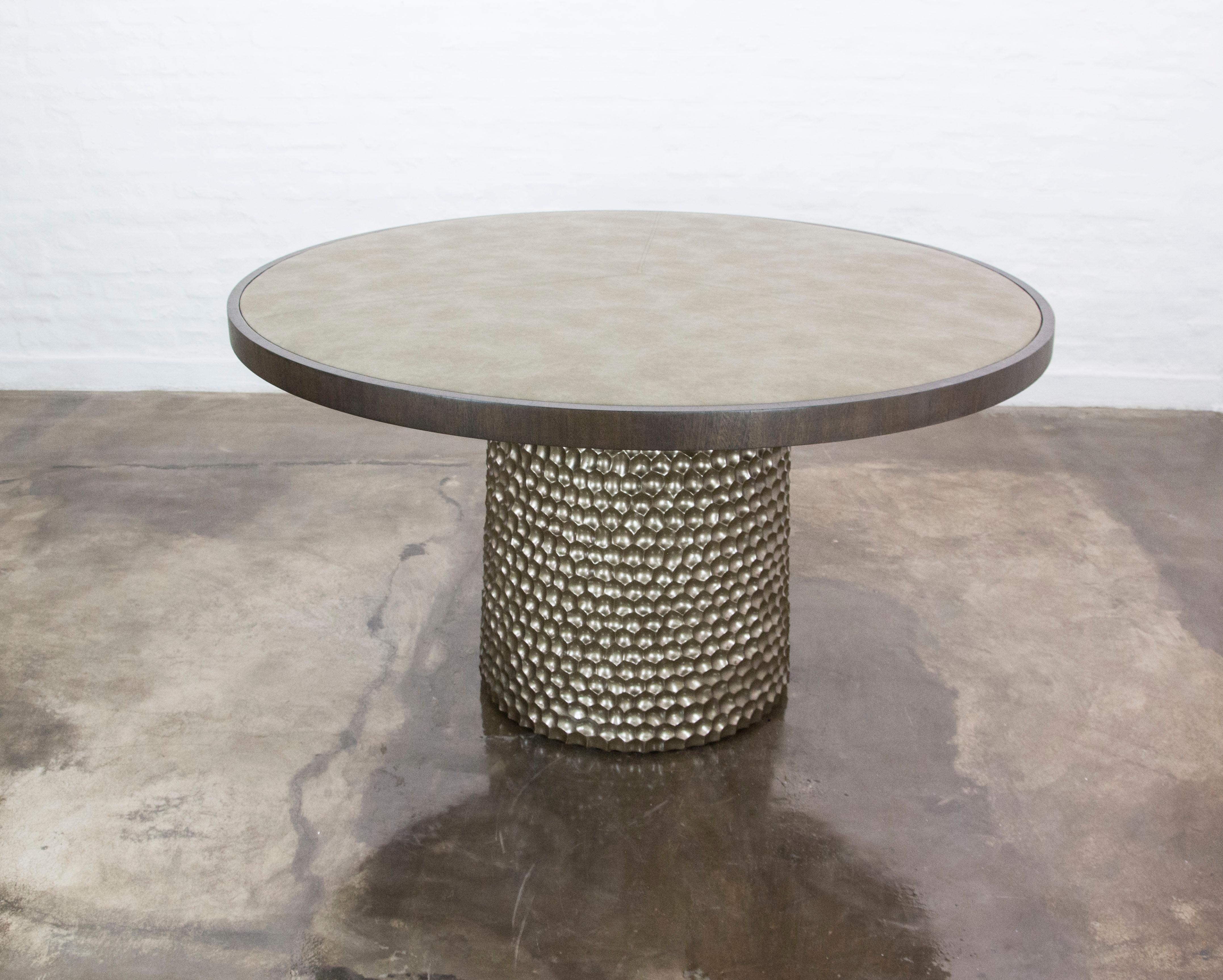 This Sculptural Round Carved Metallic Wood and Fabric Game Table from Costantini Design is hand carved and the top is upholstered in the fabric or leather of your choice.  Also suitable as a dining, serving, or center table.  

Measurements are 30