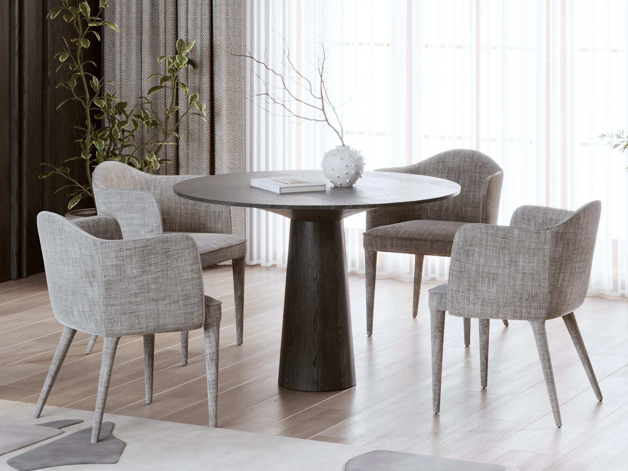 Handcrafted from solid European oak, this round dining table by designer Sergio Vulpe embodies sculptural simplicity with a bold black finish. The deep matte surface enhances its brutalist silhouette while allowing subtle traces of the oak’s natural