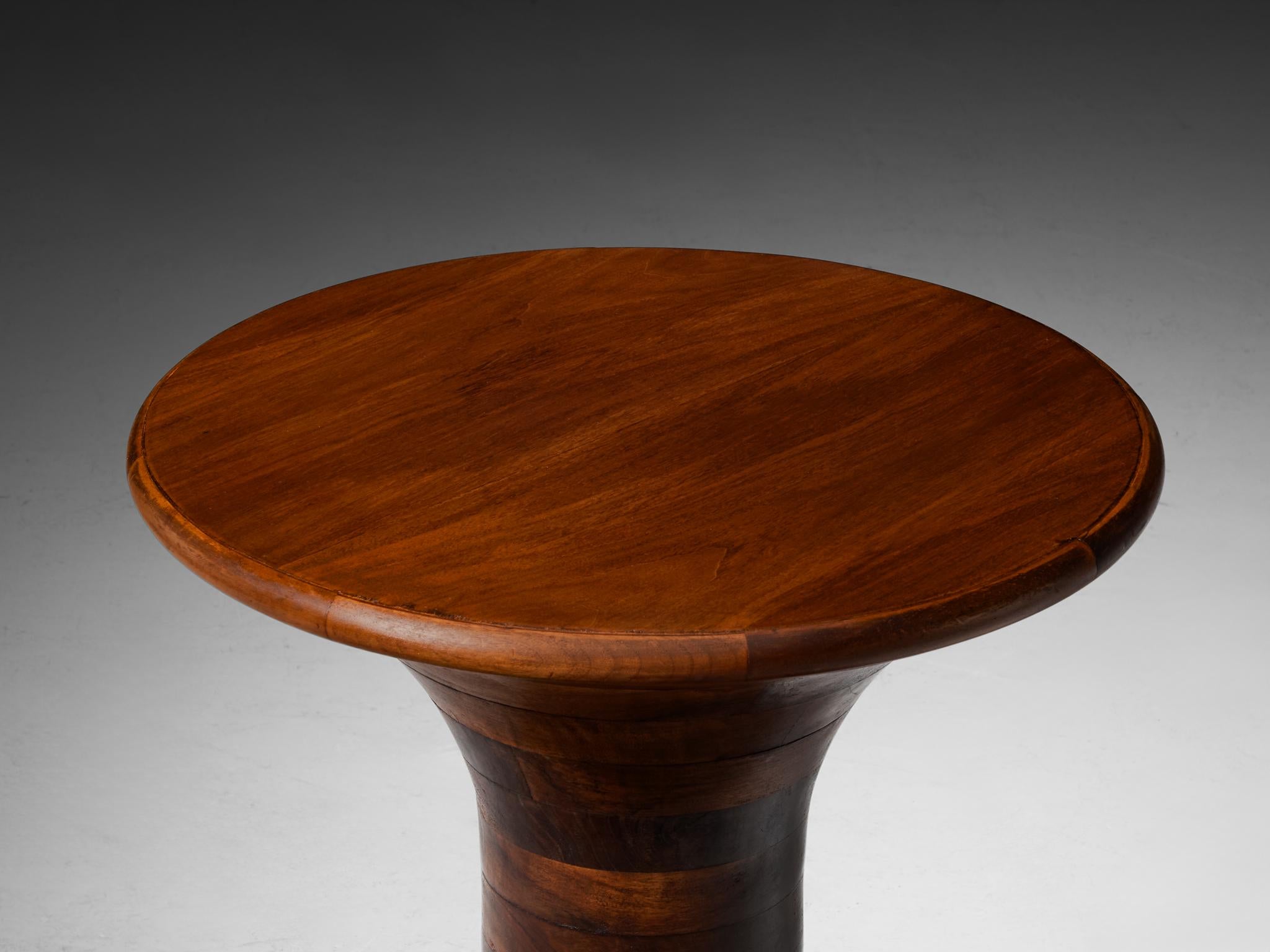 Coffee or side table, walnut, Europe, 1970s

This beautiful table, influenced by the artistic sensibilities of the Art Deco movement with a post-modern twist, is distinguished by its stately grandeur and curvilinear forms. The design is highly