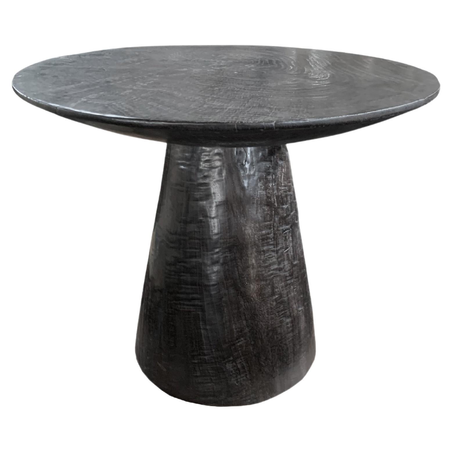 Sculptural Round Table Crafted from Mango Wood, Burnt Finish, Modern Organic