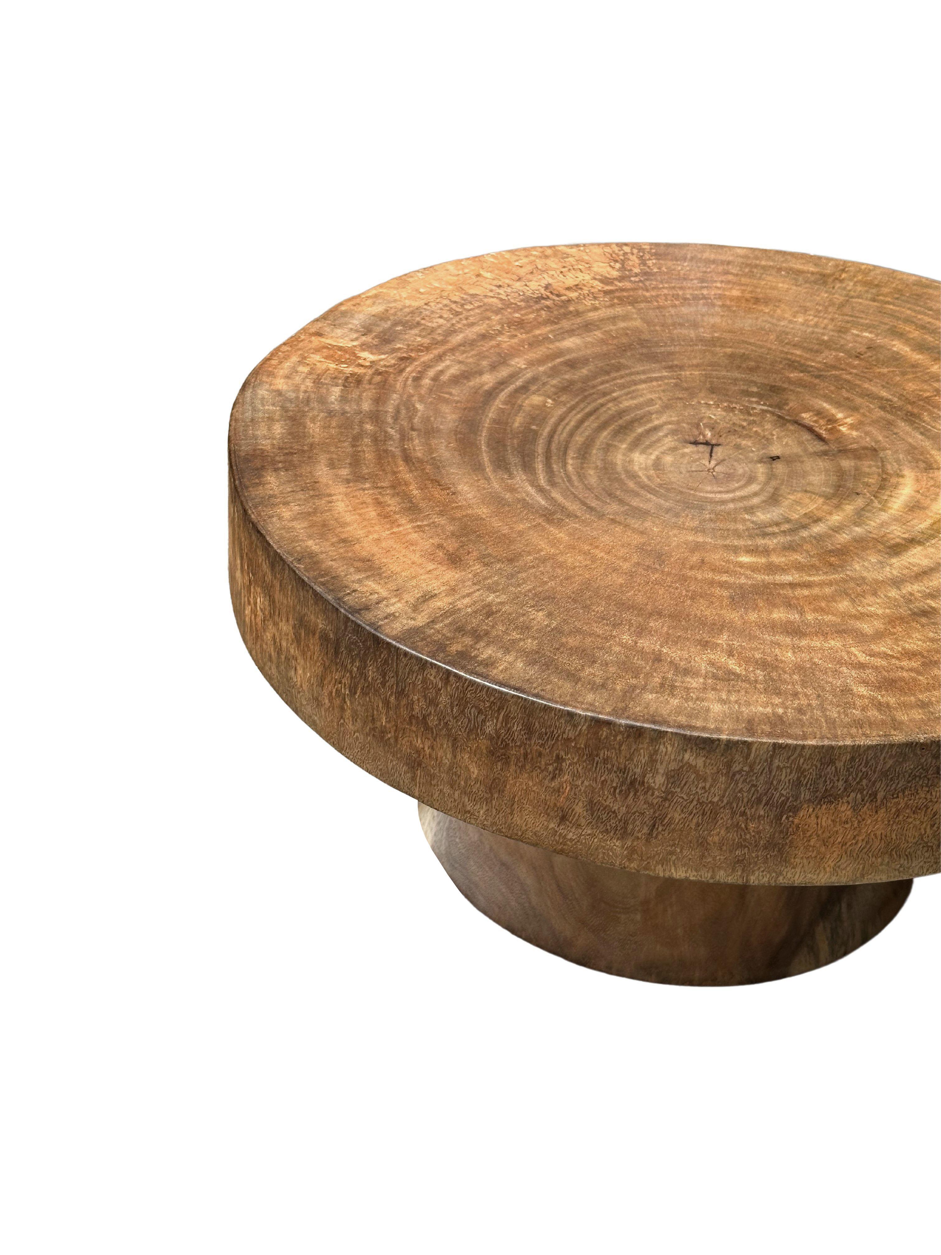 Hand-Crafted Sculptural Round Table Crafted from Solid Mango Wood, Natural Finish For Sale