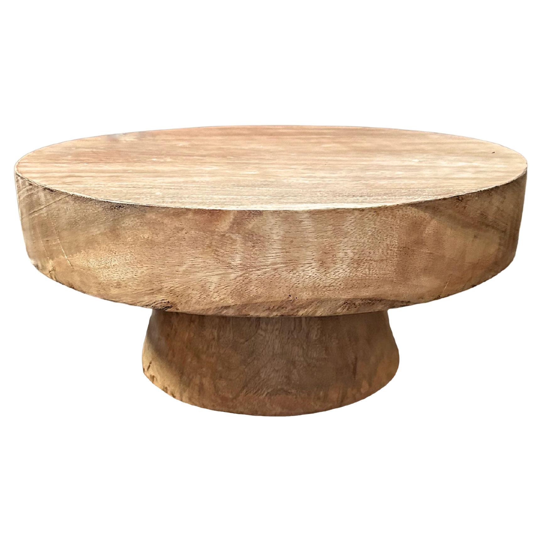 Sculptural Round Table Crafted from Solid Mango Wood, Natural Finish For Sale