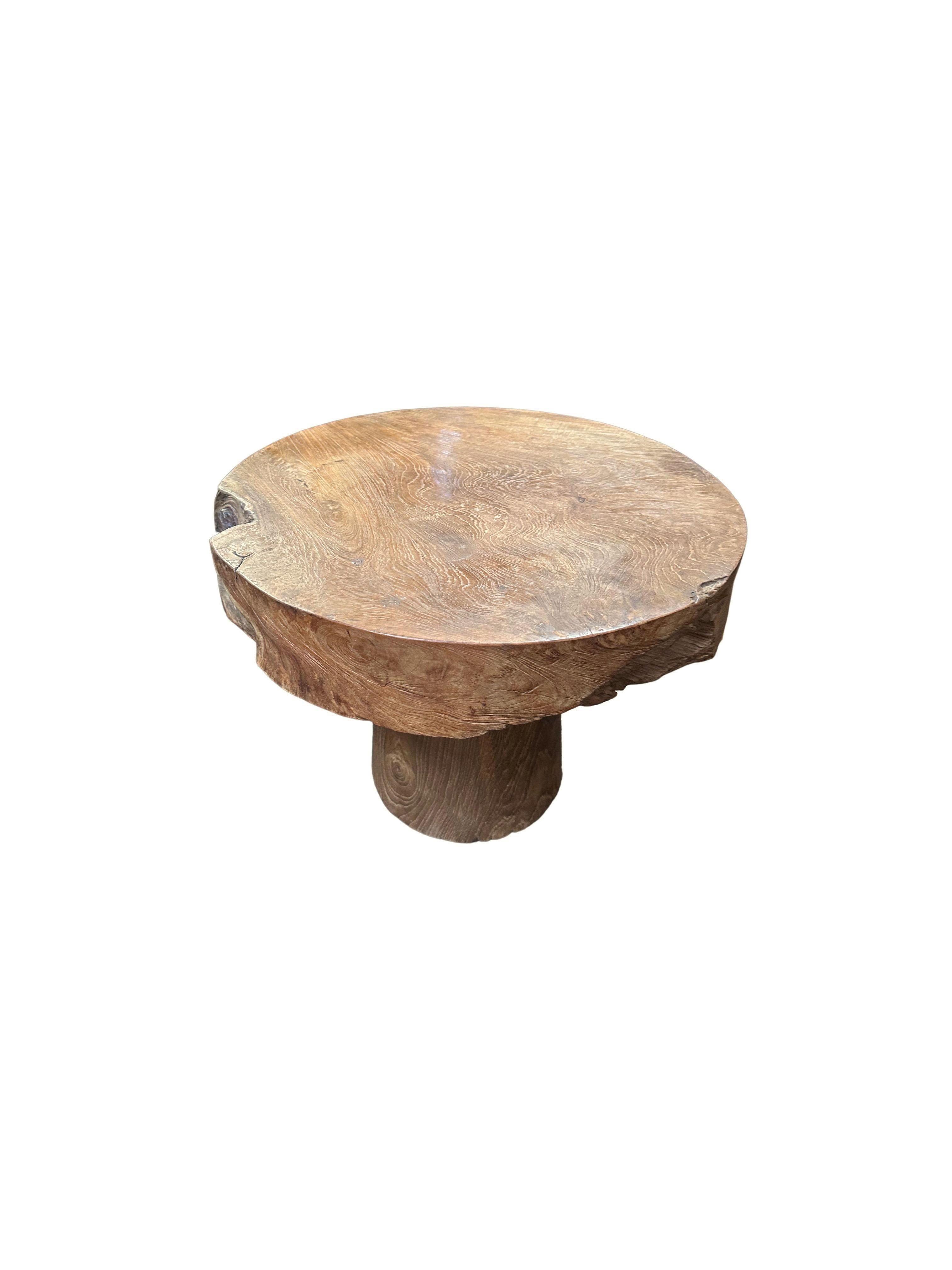 Indonesian Sculptural Round Table Crafted from Teak Wood, Natural Finish For Sale