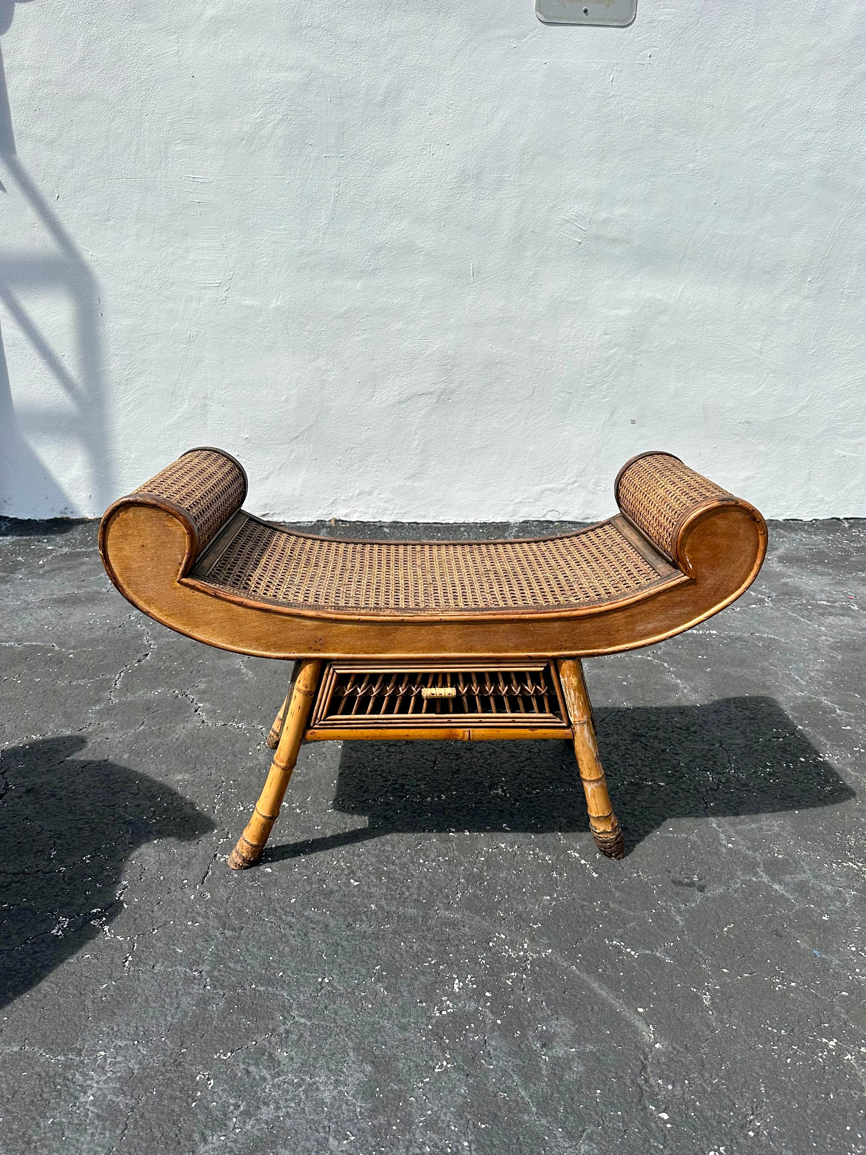 On offer on this occasion is one of the most stunning and rare, rattan mini bench or side table you could hope to find. In original and unfinished condition. Outstanding design is exhibited throughout. The beautiful versatile piece is statement