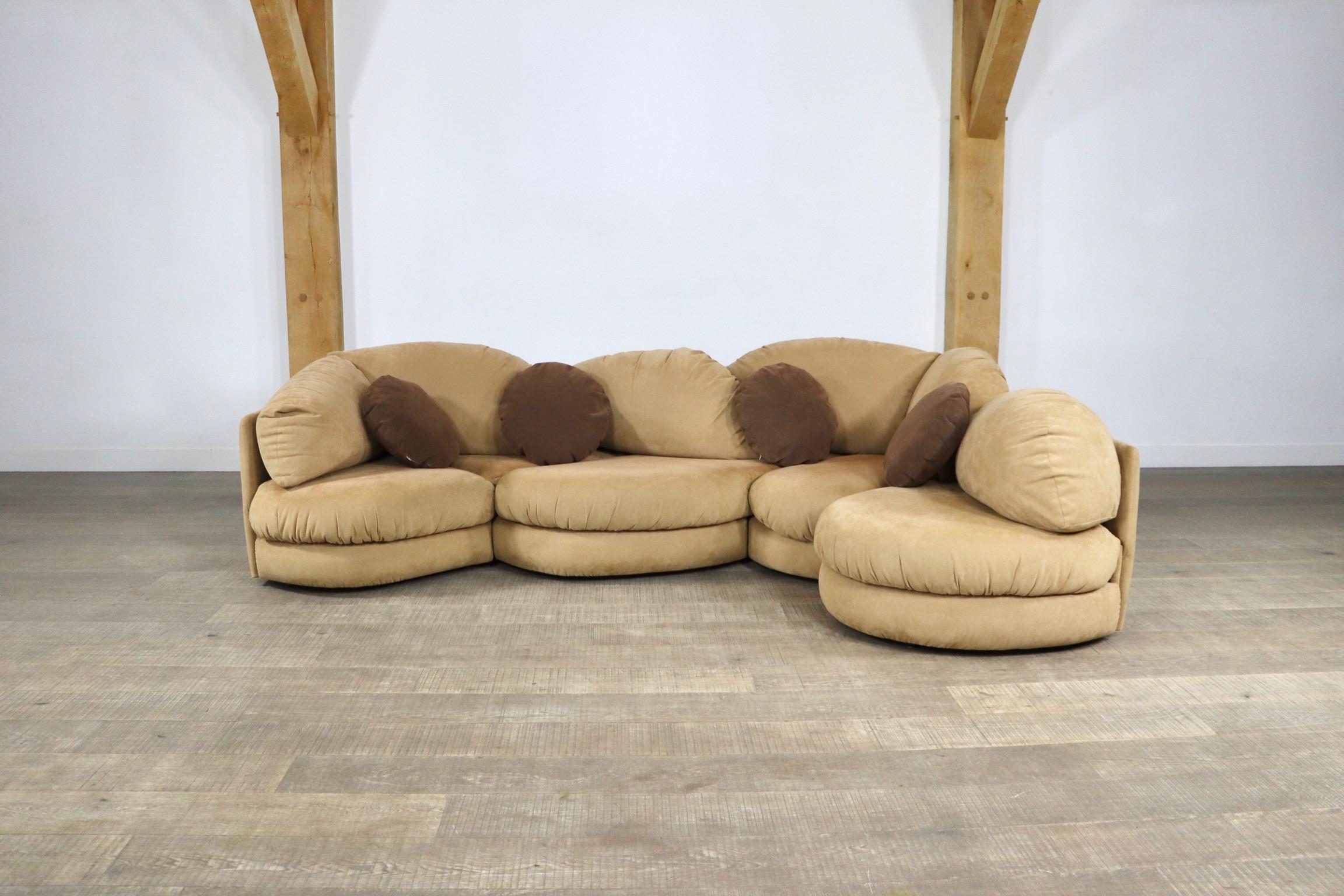 Very rare sectional sofa manufactured in the 1970s by Wiener Werkstätten 
The sofa consists of 4 interconnected segments that create a stunning sculptural, organic form, upholstered in soft beige alcantara. The designer is unknown although