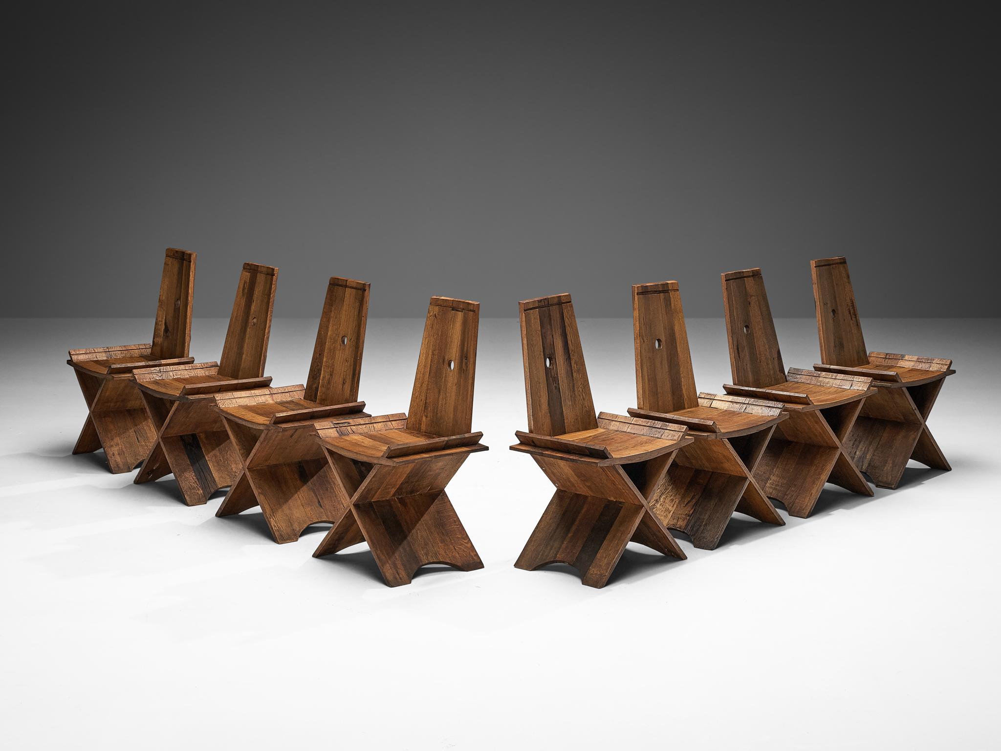 Set of eight dining chairs, oak, iron, Europe, 1970s

These chairs exemplify a harmonious synthesis, seamlessly blending the robustness inherent in Brutalist style with the understated simplicity characteristic of rustic design. The backrest is