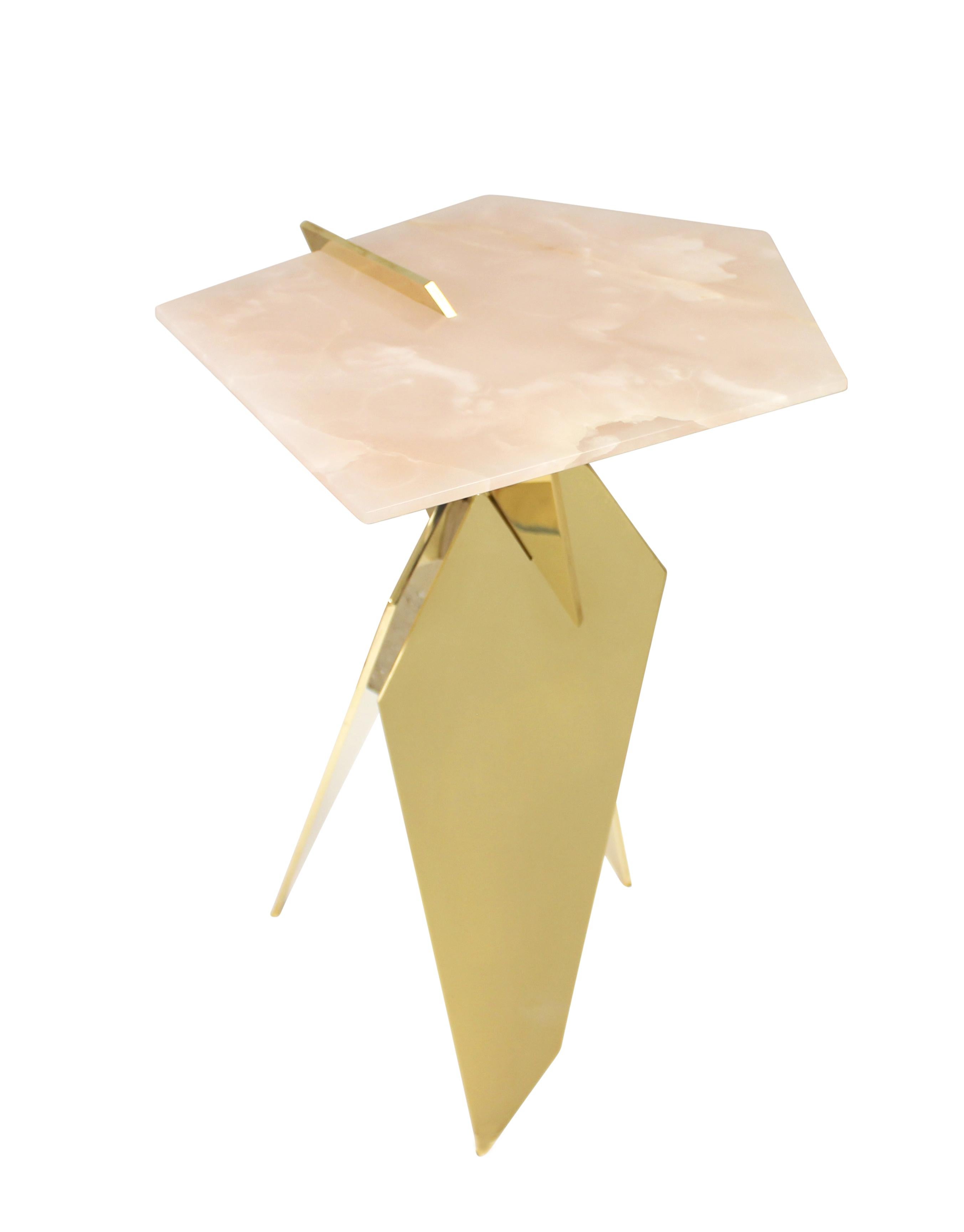 Sculptural side table made of hand polished solid bronze plates topped with pink onyx stone. Available in custom sizes, materials, and finishes.