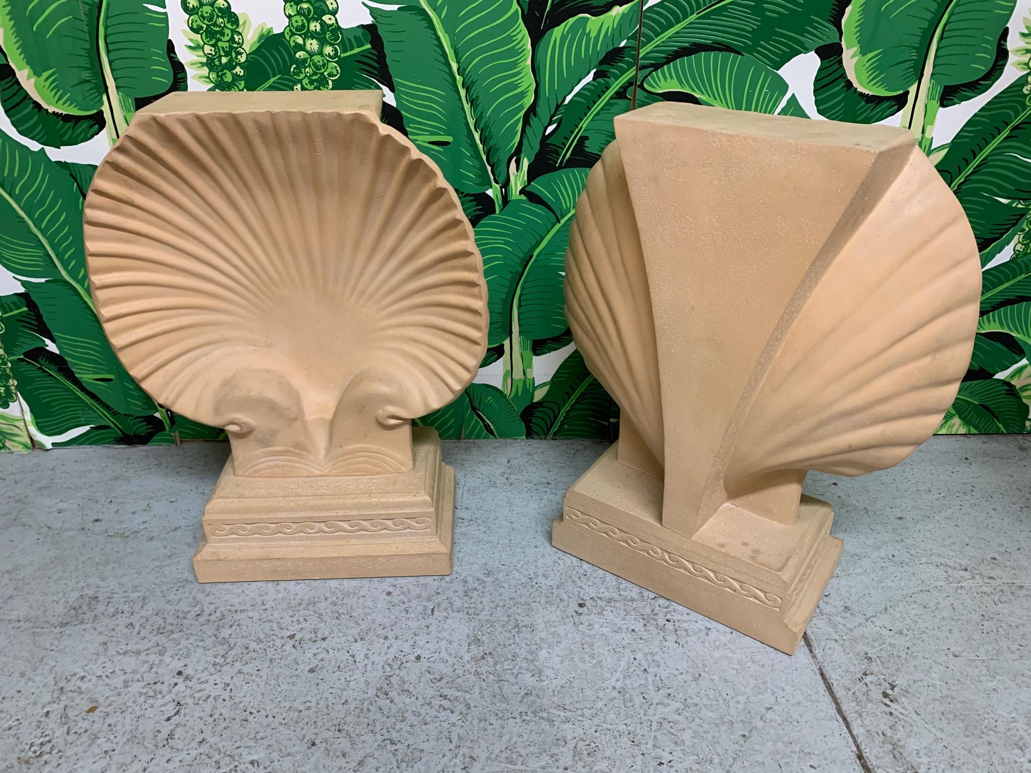 Pair of heavy plaster table bases in a shell motif in the style of Serge Roche or Grosfeld House. Can be used together as a dining table base or individually as console or sofa tables. Very good condition with minor imperfections consistent with age.