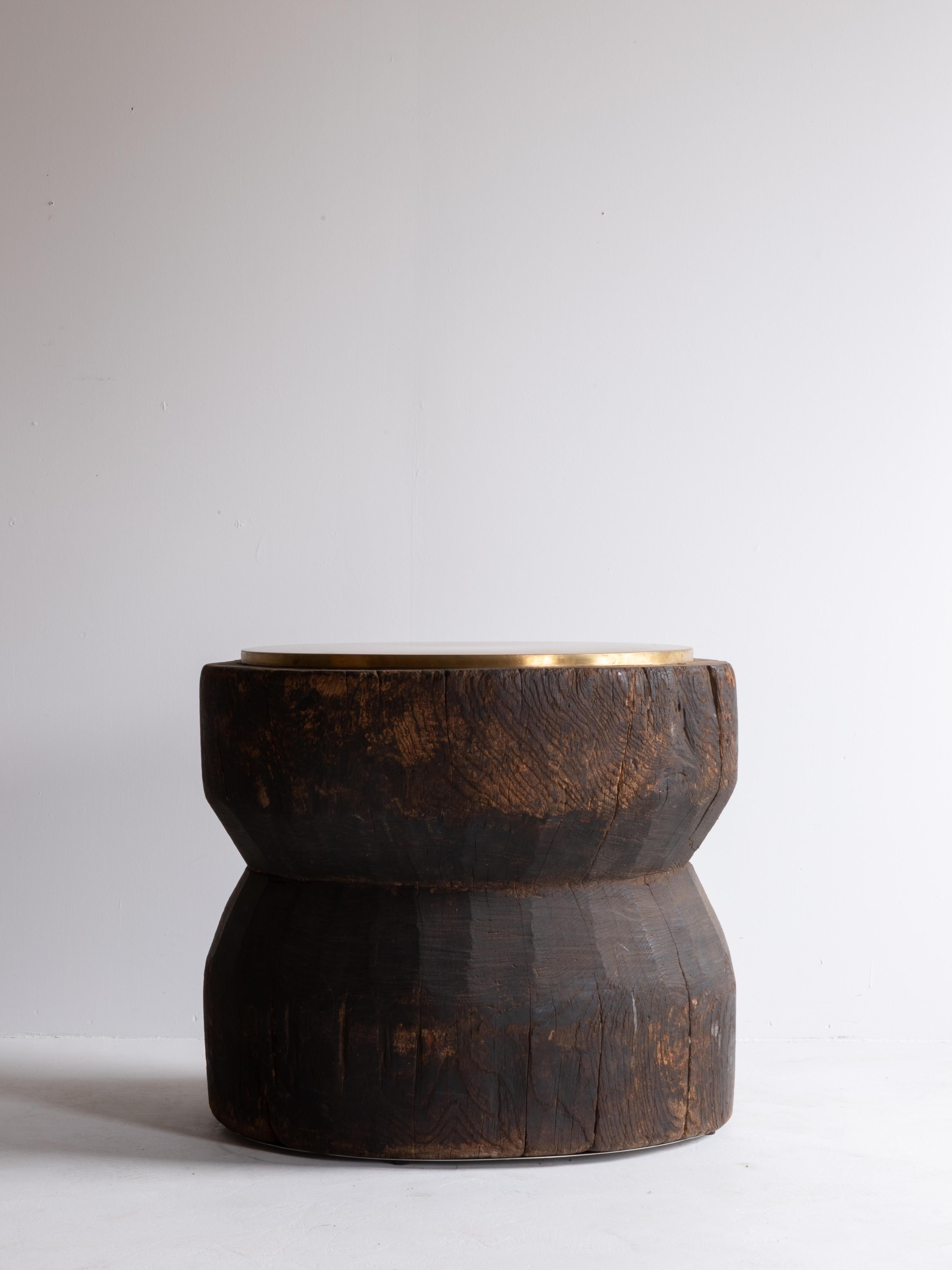This unique side table is crafted from an original usu—a traditional Japanese mortar—dating back to the Meiji period (1868–1912).
The rich, sculptural form and weathered surface tell the quiet story of decades of use, giving the piece an