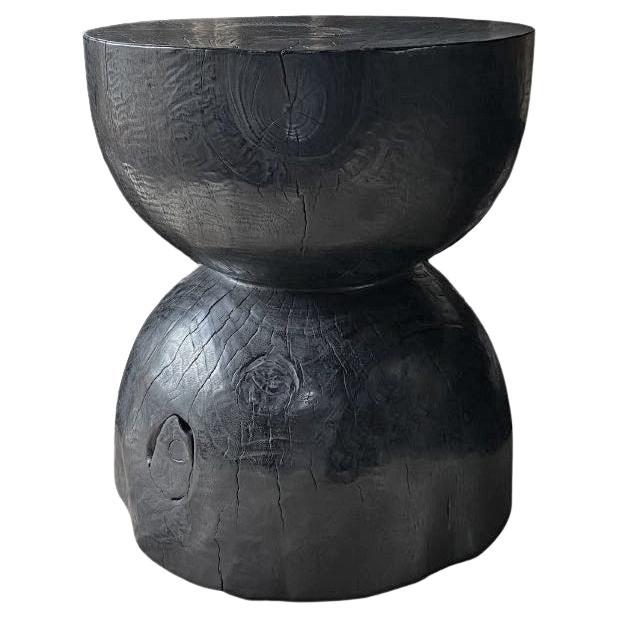 Sculptural Side Table Crafted from Solid Mango Wood Burnt Black Finish For Sale