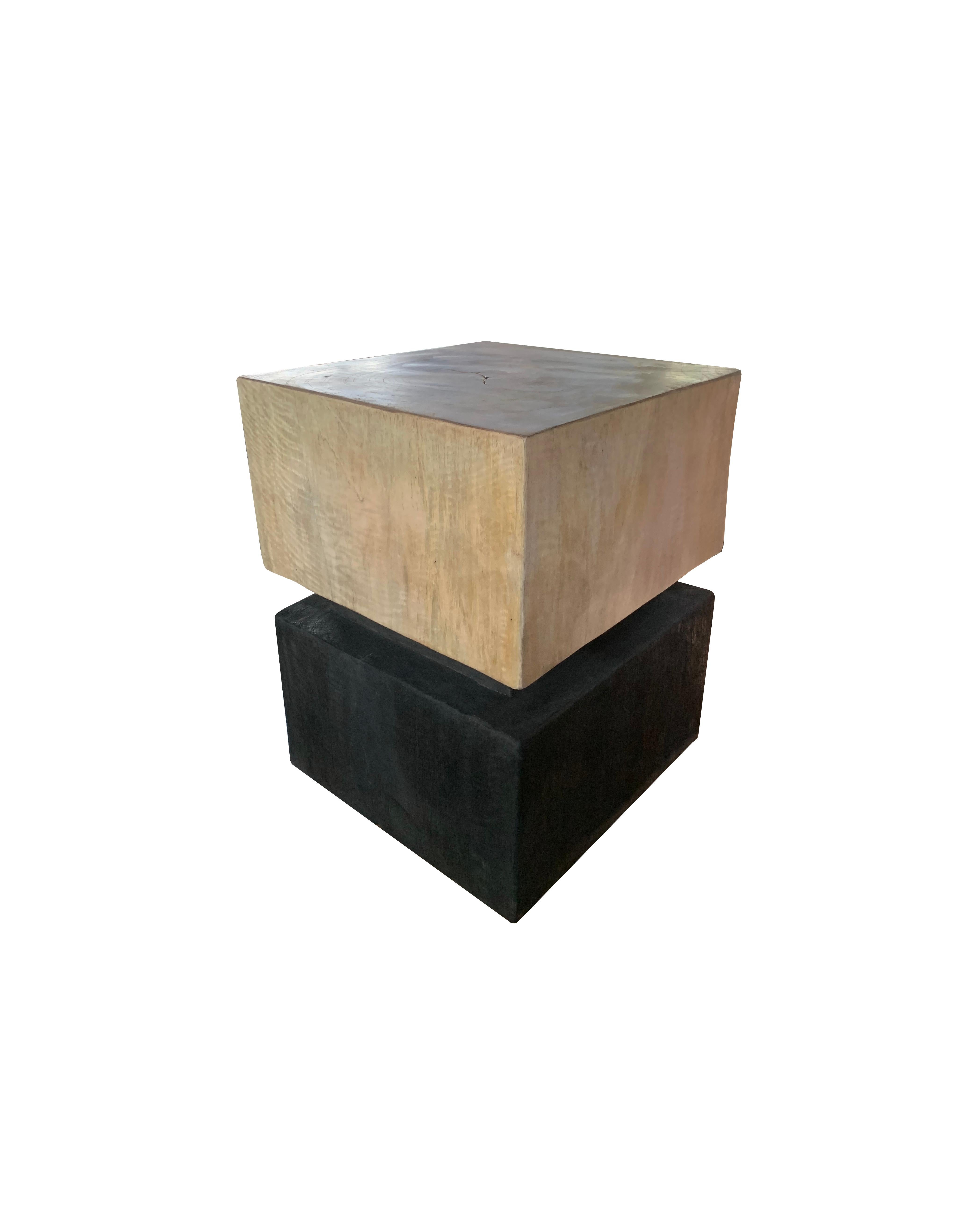 A wonderfully sculptural round side table or stool. Its neutral pigments make it perfect for any space. A uniquely sculptural and versatile piece certain to invoke conversation. It was crafted from a solid block of mango wood and has a smooth