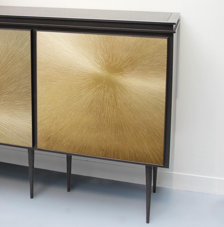 This stunning cabinet is made by a famous French Artist-Designer.
This bronze cabinet is composed by three astres. 
Seven textured steel branches legs sustain the piece. 
The medium dark patina enhance the stars radiance.

Pictures 4 and 5 are from