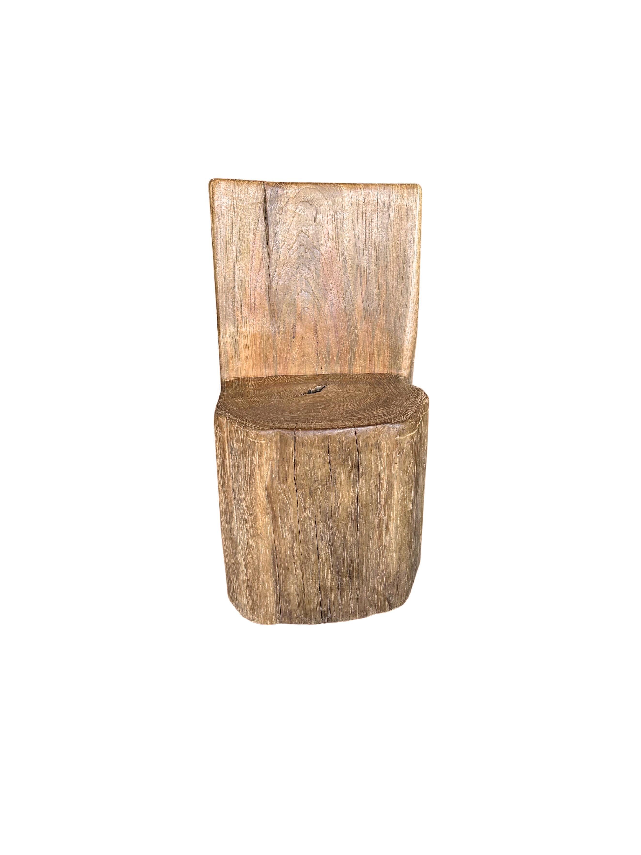 This solid teak wood chair was uniquely crafted from a 
