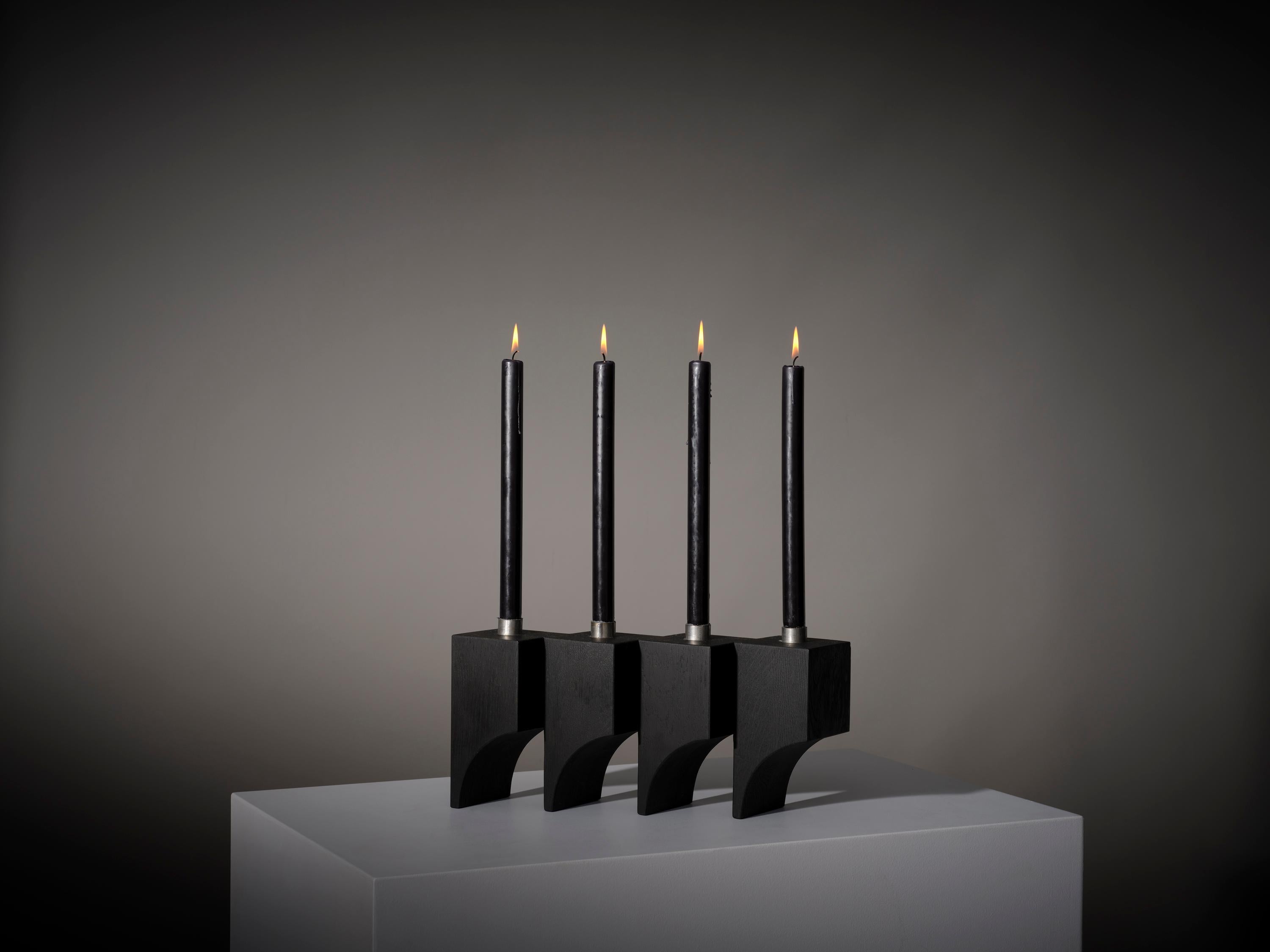 The Acer candle holder R:4 features a rhythmic architectural interplay of cubic volumes and semi arched voids. Designed by Aad Bos and hand crafted by our carpenters from solid oak wood and steel.

Mokko is an Amsterdam based design studio with a