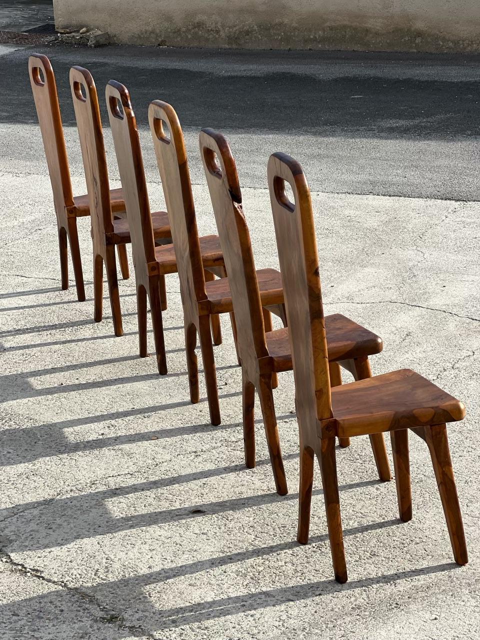 Exceptional set of 6 sculptural chairs in solid olive wood with high backs by a French cabinetmaker from the Maison Skela 1960.
the woodwork has been designed to respect the structure of the wood 
Very good condition 
Height : 110 cm 
Width : 35 cm