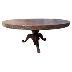 Tavolo da pranzo scultoreo in legno massiccio di teak con venatura naturale espressiva