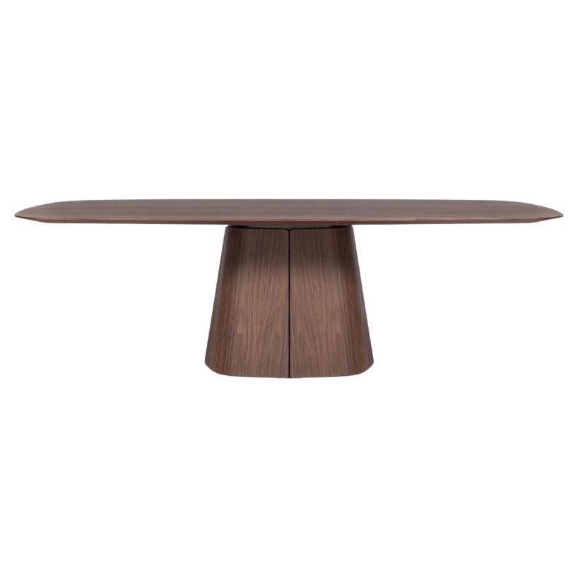 Table de salle à manger sculpturale en noyer massif avec socle effilé
