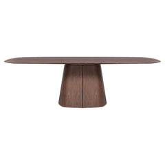 Table de salle à manger sculpturale en noyer massif avec socle effilé